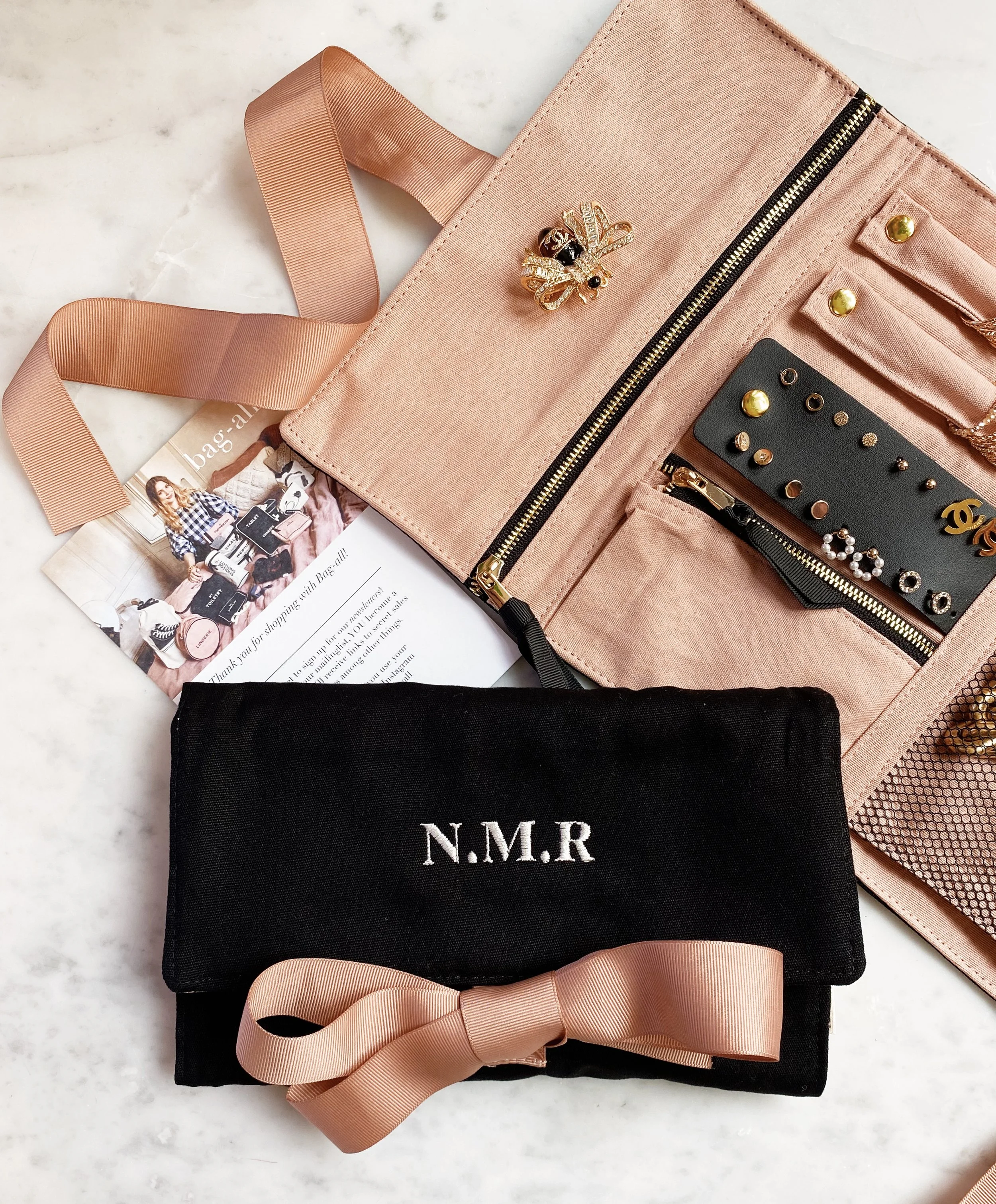 Travel jewelry case showing secure earring storage panel