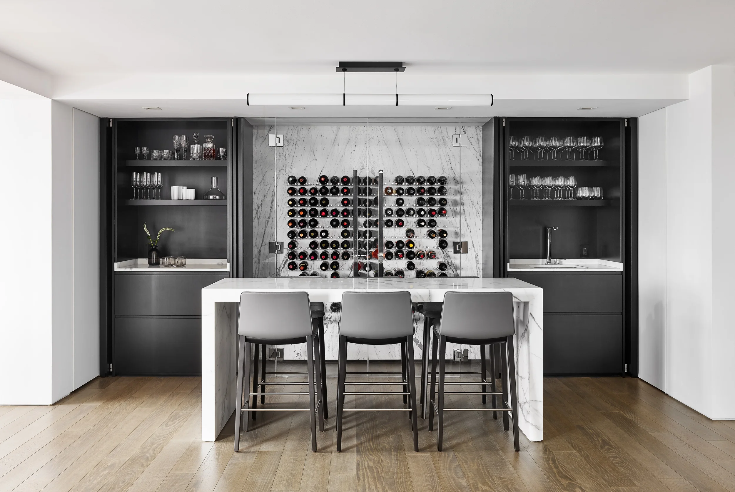 Luxury apartment renovation featuring a modern home wine bar