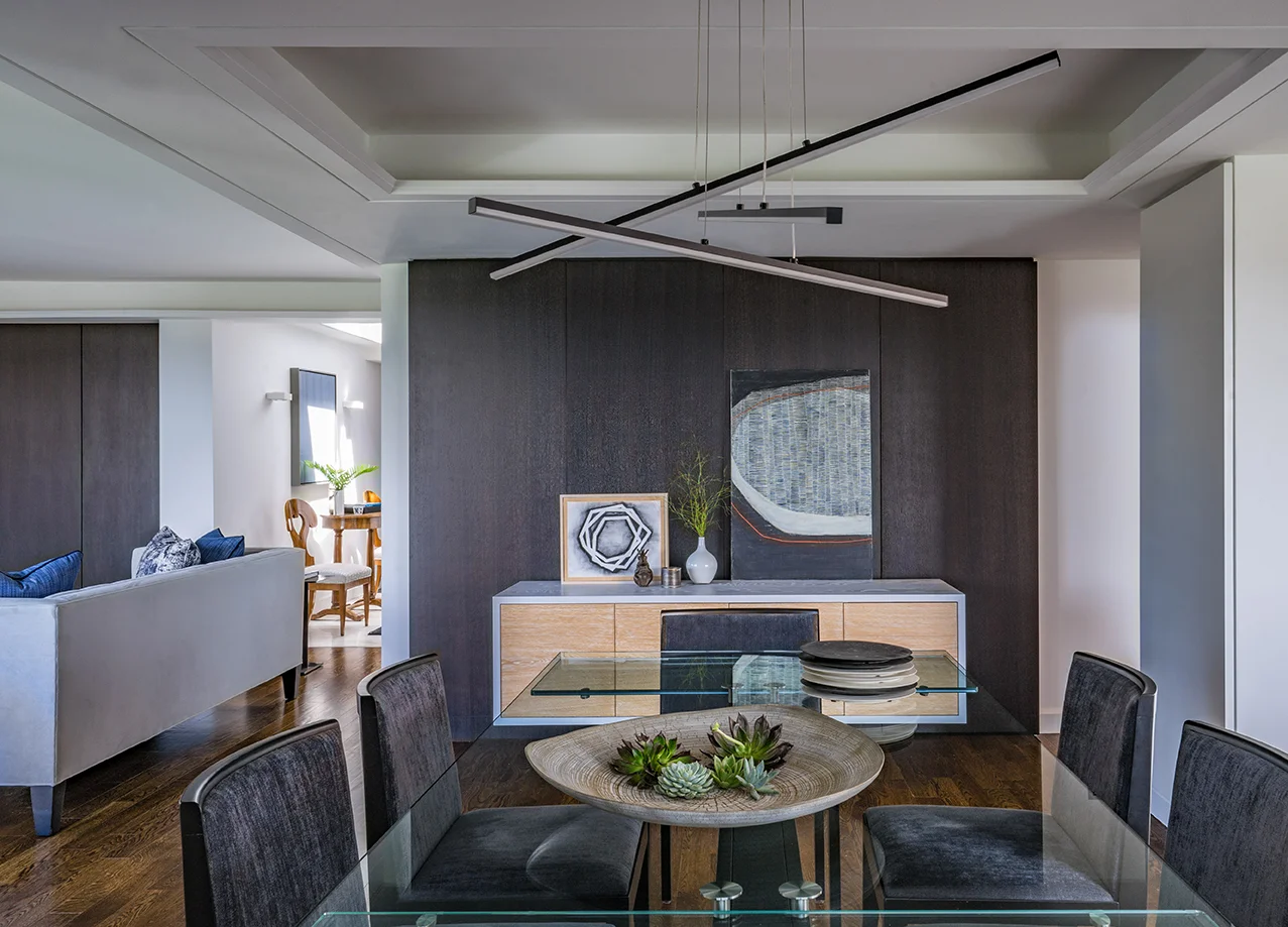 Contemporary dining room in a renovated penthouse in Boston