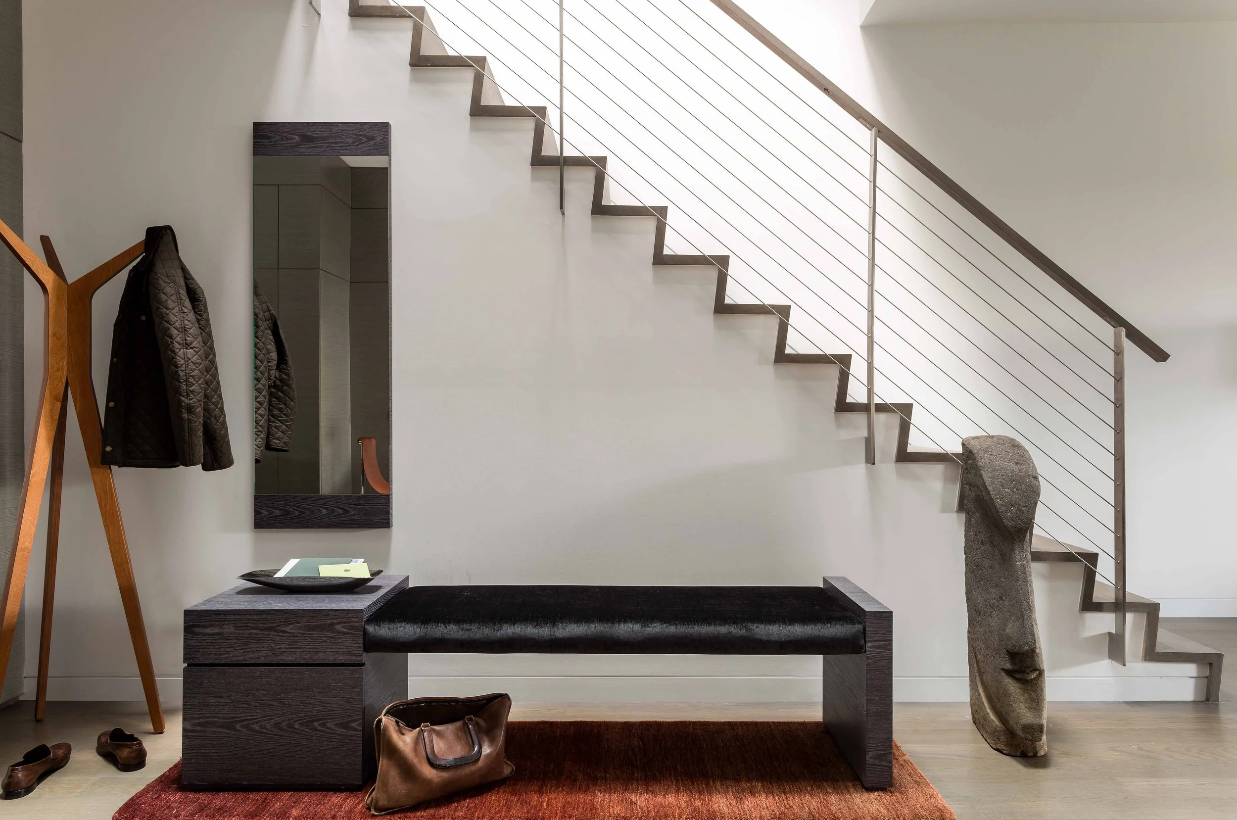 A modern staircase bathed in soft daylight in the center of a Boston Townhouse. (Copy)