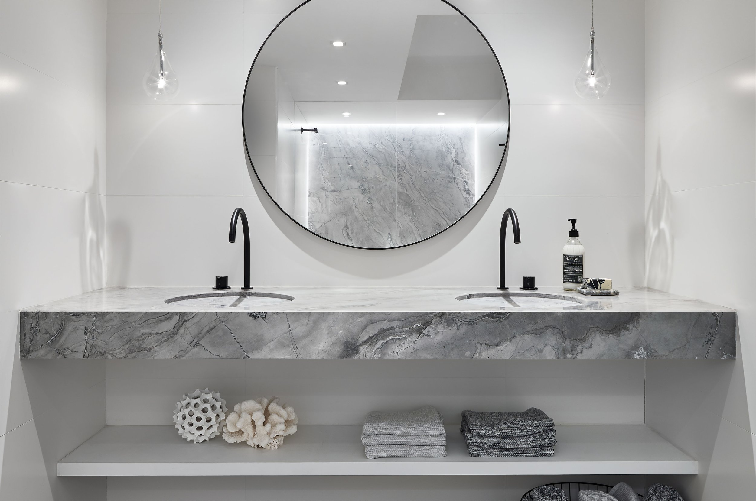 Minimalist stone vanity design for a Boston Condo renovation