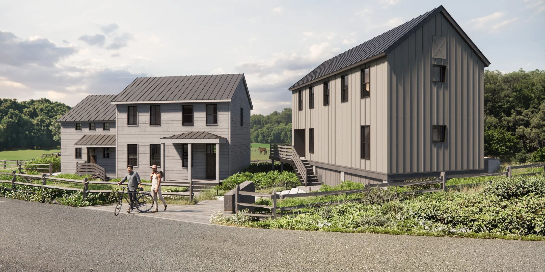 Three gray multifamily residences built in the style of modern farmhouses, surrounded by farmland