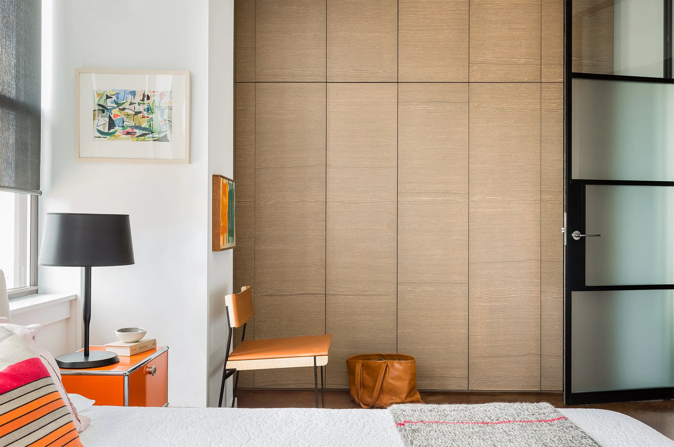 Loft bedroom with industrial design style featuring a wall built-in storage