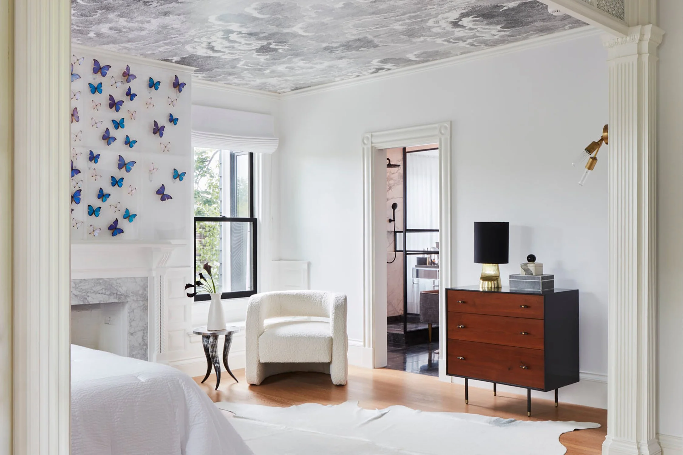 Scandinavian primary bedroom suite featuring a bright color palate