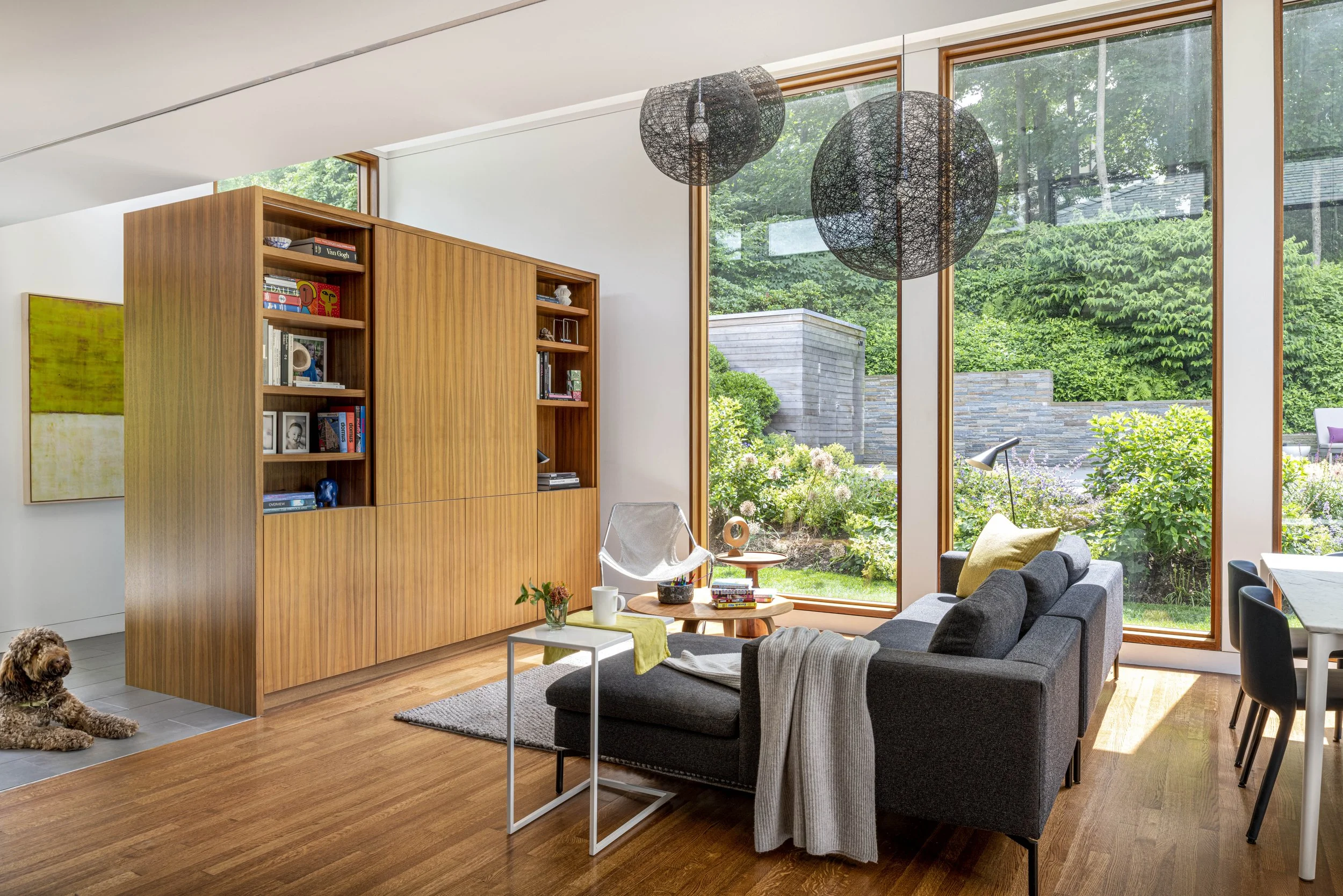 Modern family room addition with high ceilings and large windows,