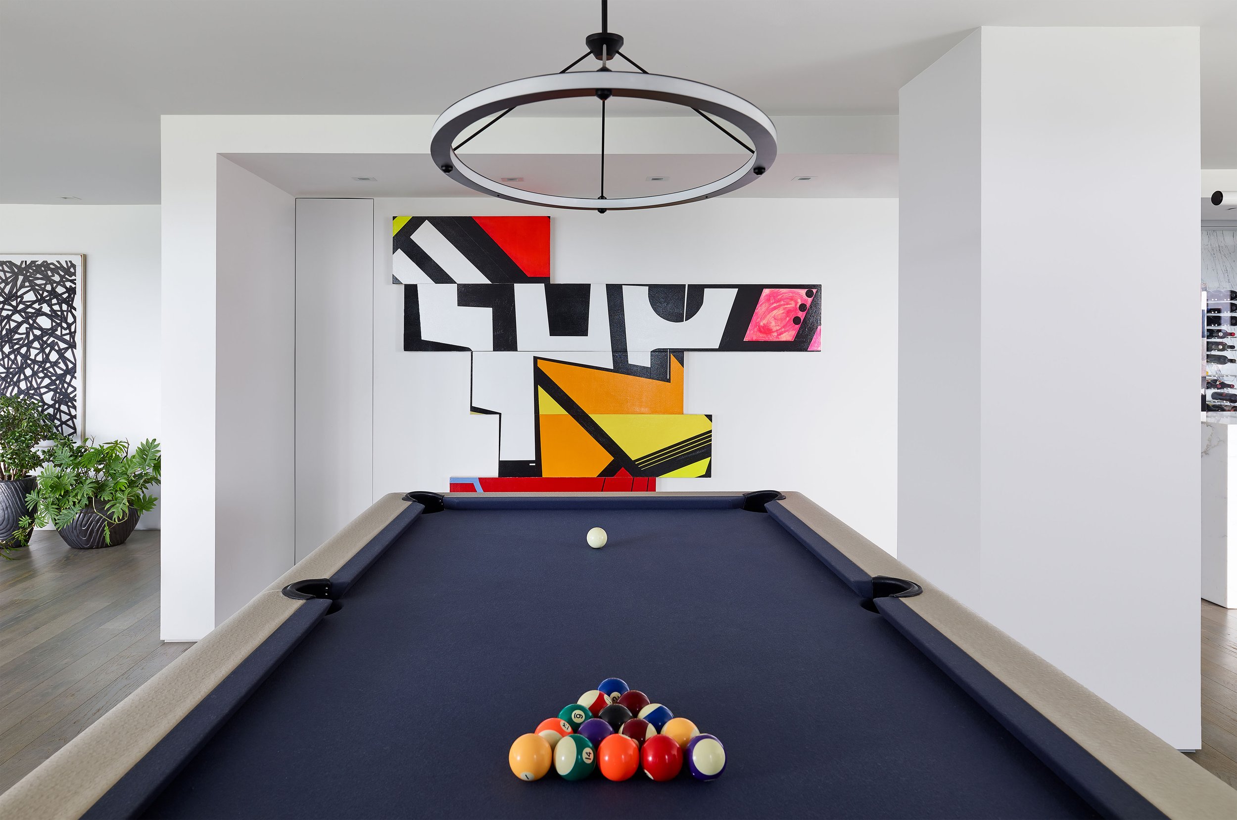 a blue billiards table in a renovated Boston condo
