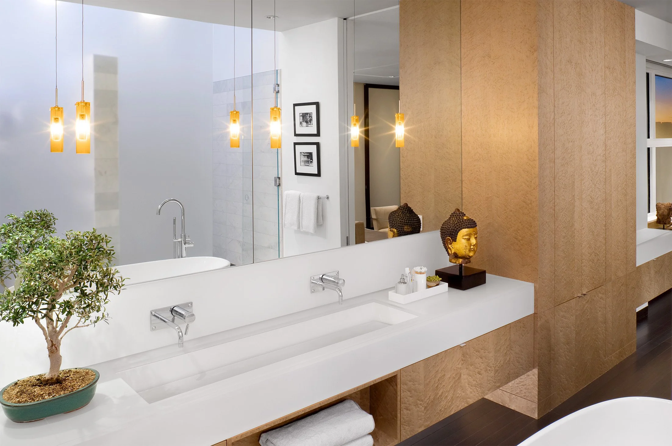 A trough sink in a contemporary custom bathroom vanity