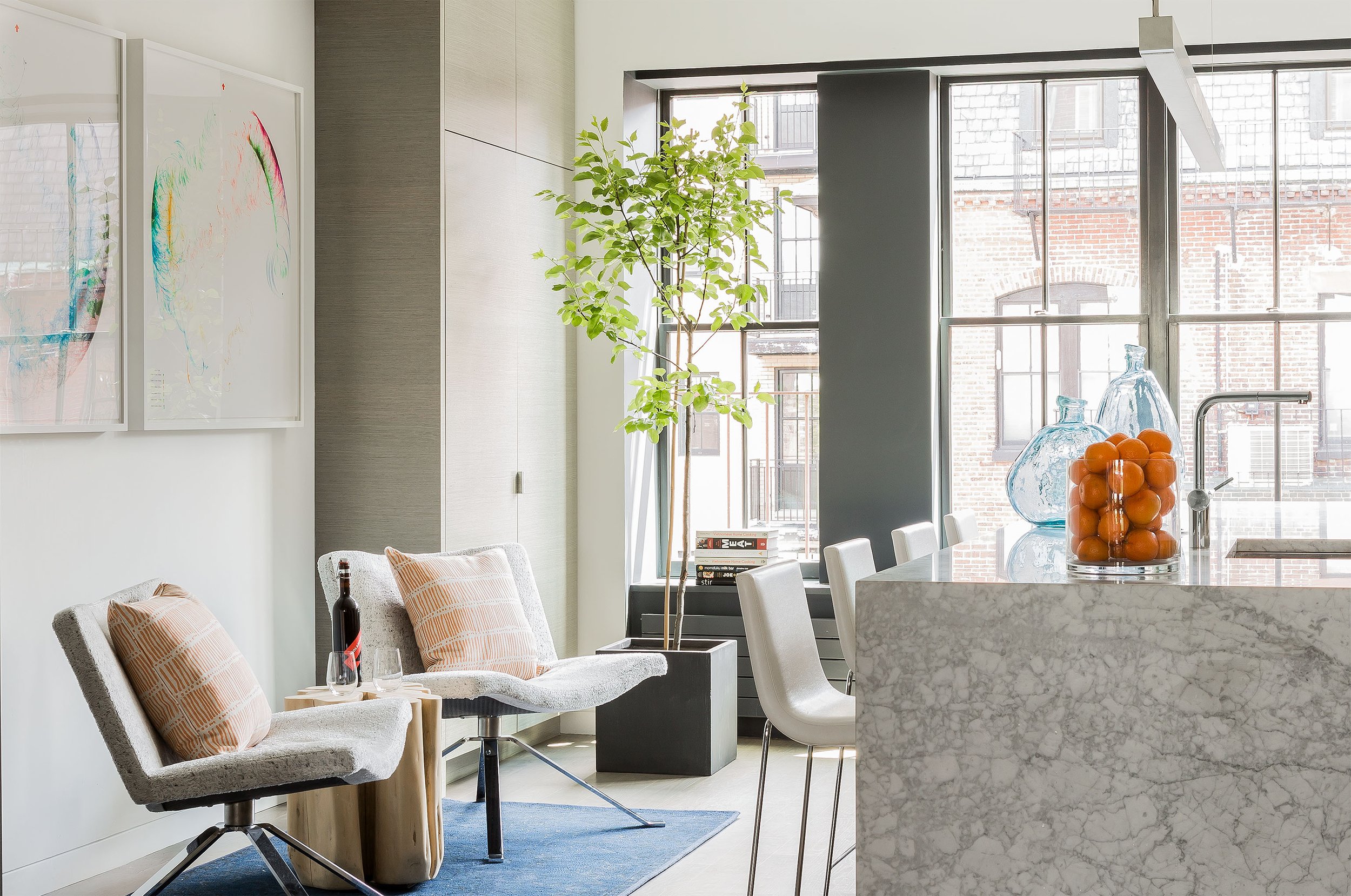 A renovated modern kitchen with a marble island in a Back bay townhouse