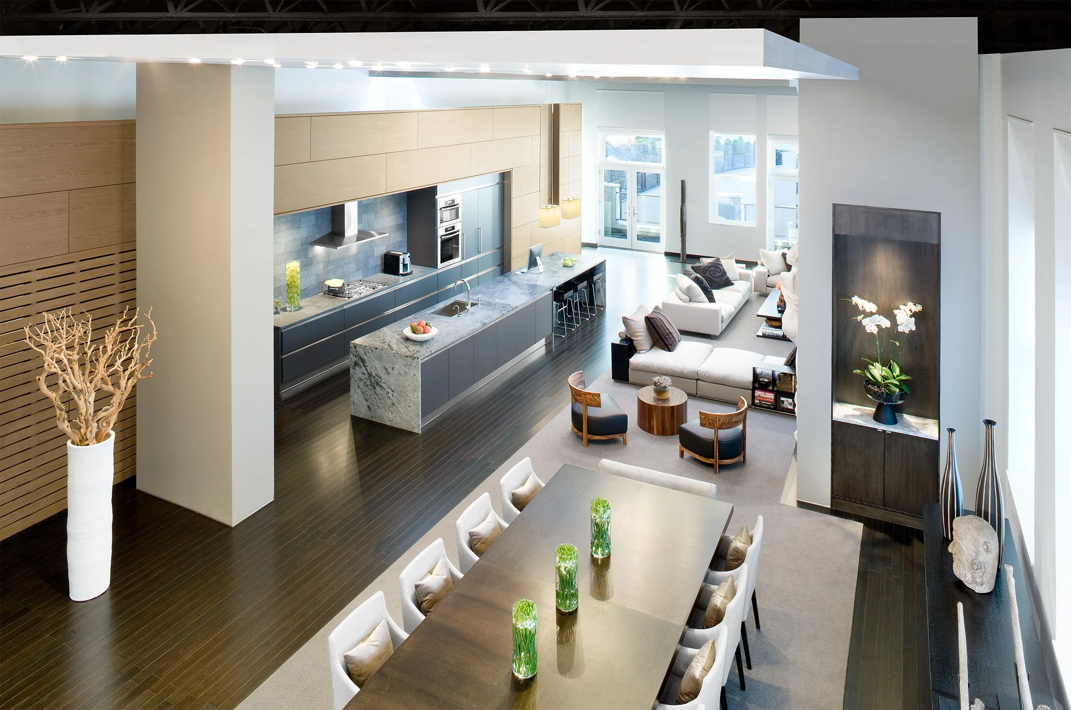 A large modern loft interior with contemporary furniture and modern artwork 
