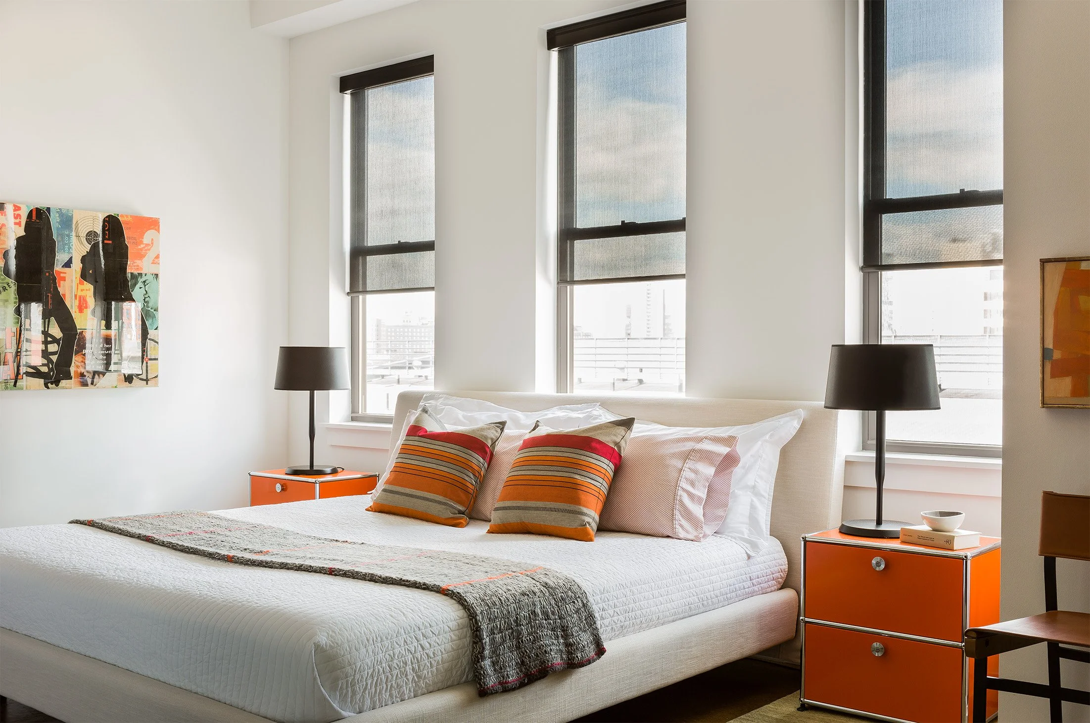A modern bedroom with industrial inspired furniture