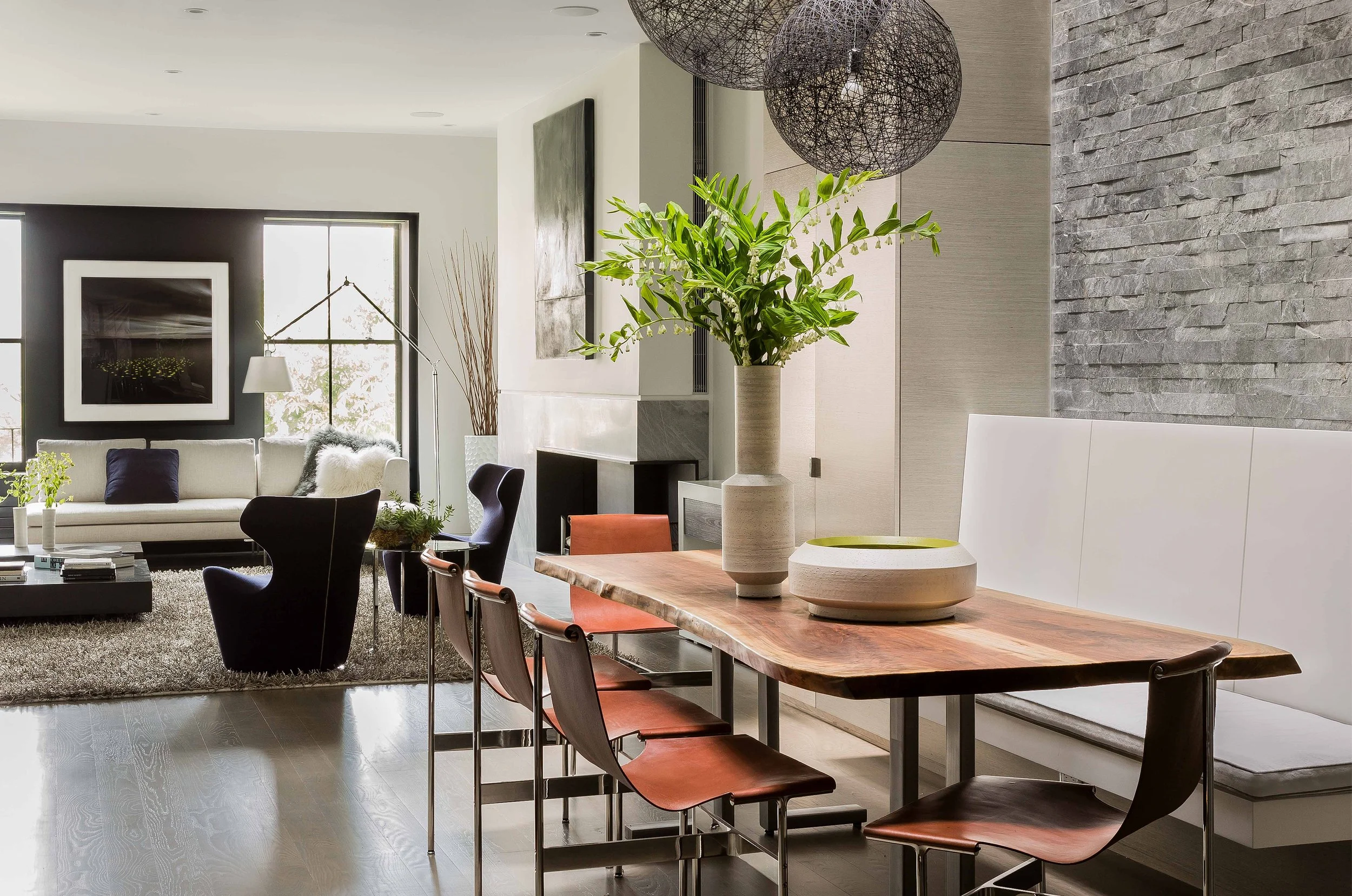 Living and dining room spaces in the Atrium House designed by Walker Architects