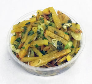 Golden beet boiled salad with scallions and parsley.