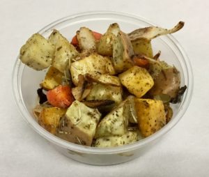 Roasted roots of carrot, sweet potato, rutabaga, parsnip, onion and garlic with rosemary and nori (seaweed) flakes.