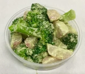 Boiled salad of broccoli and red radish with a sesame seed dressing.