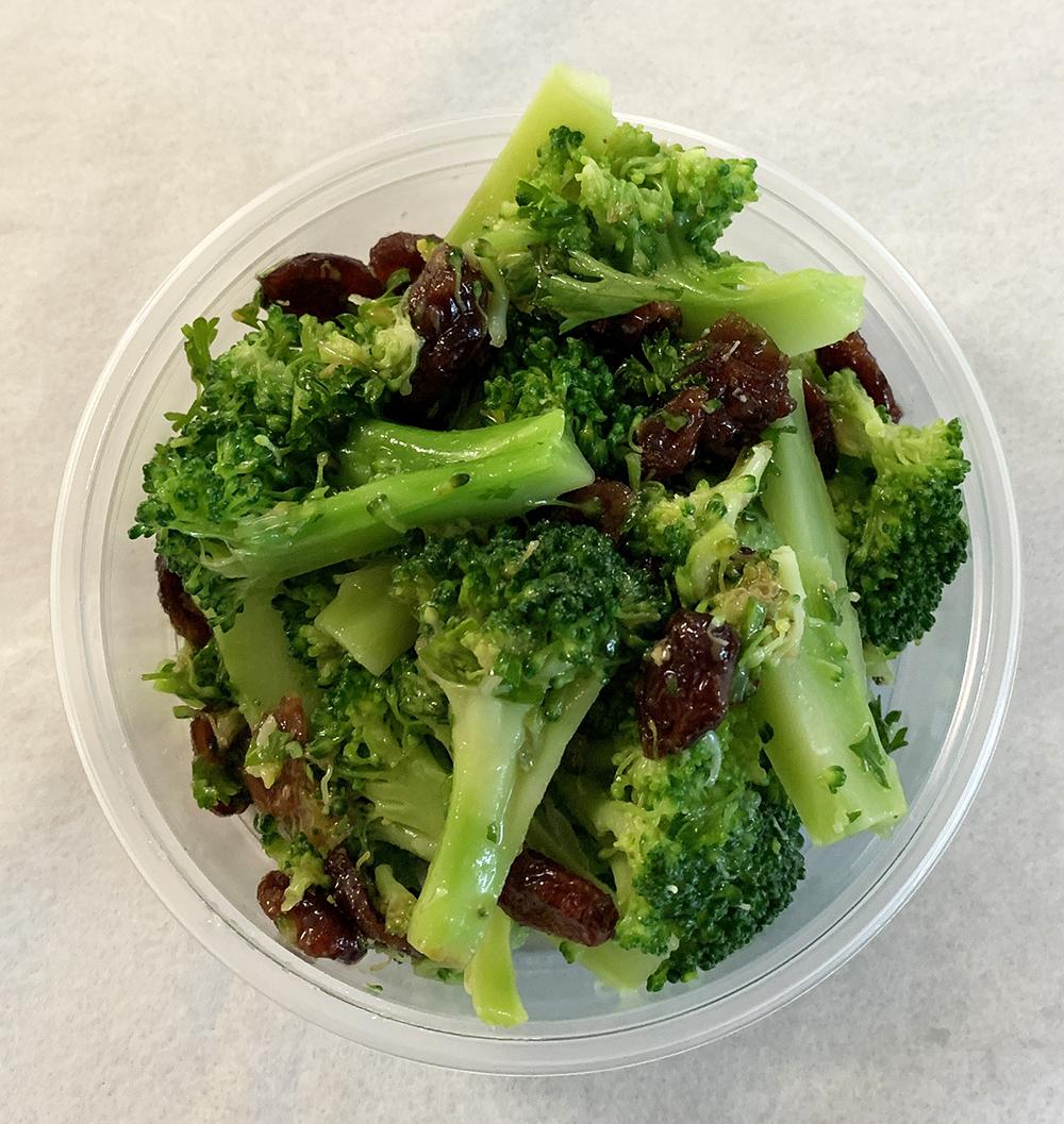 Blanched broccoli with roasted garlic and cranberries.