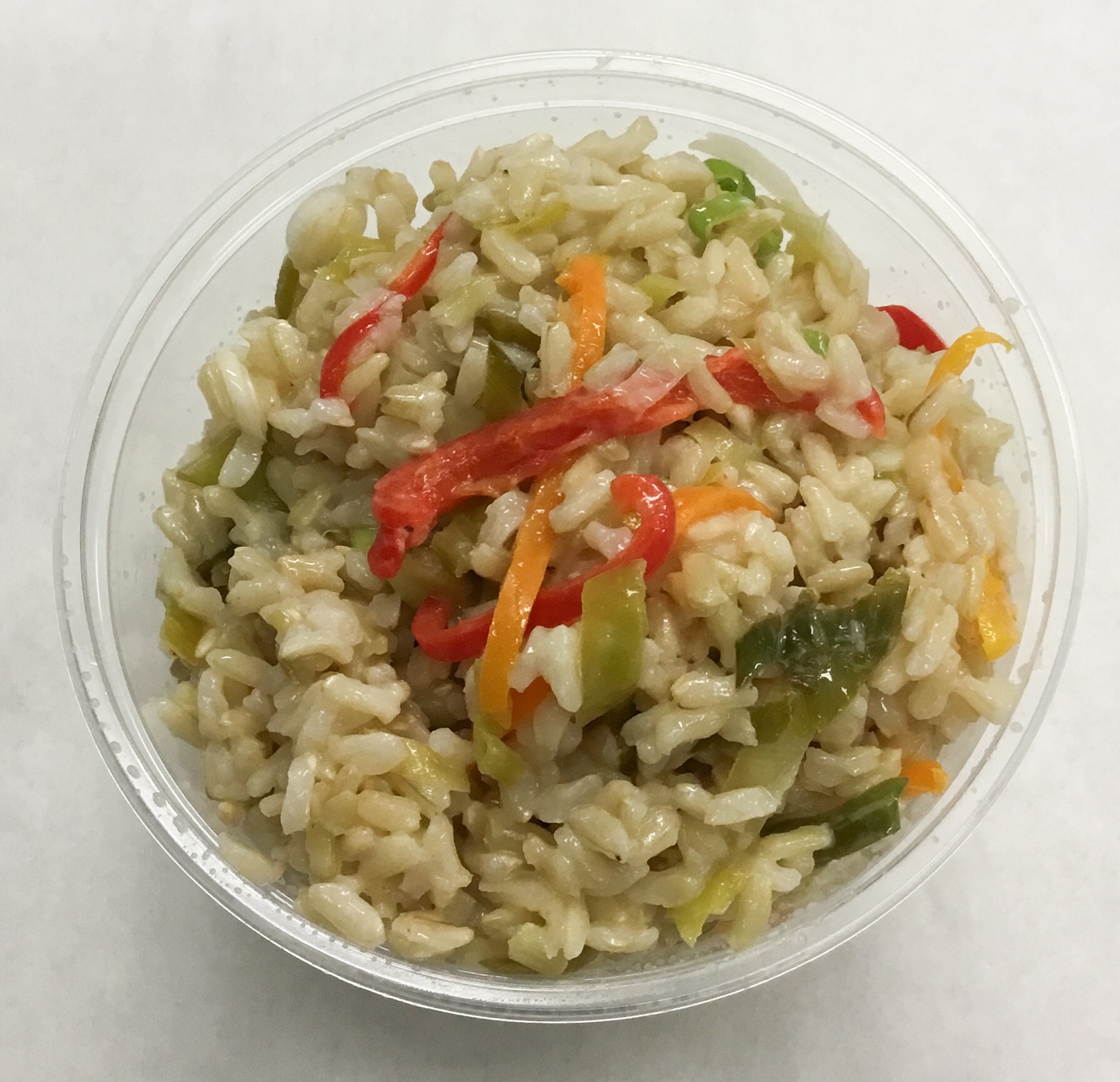 Brown basmati rice salad with bell peppers, leeks, scallions, white miso and yuzu.