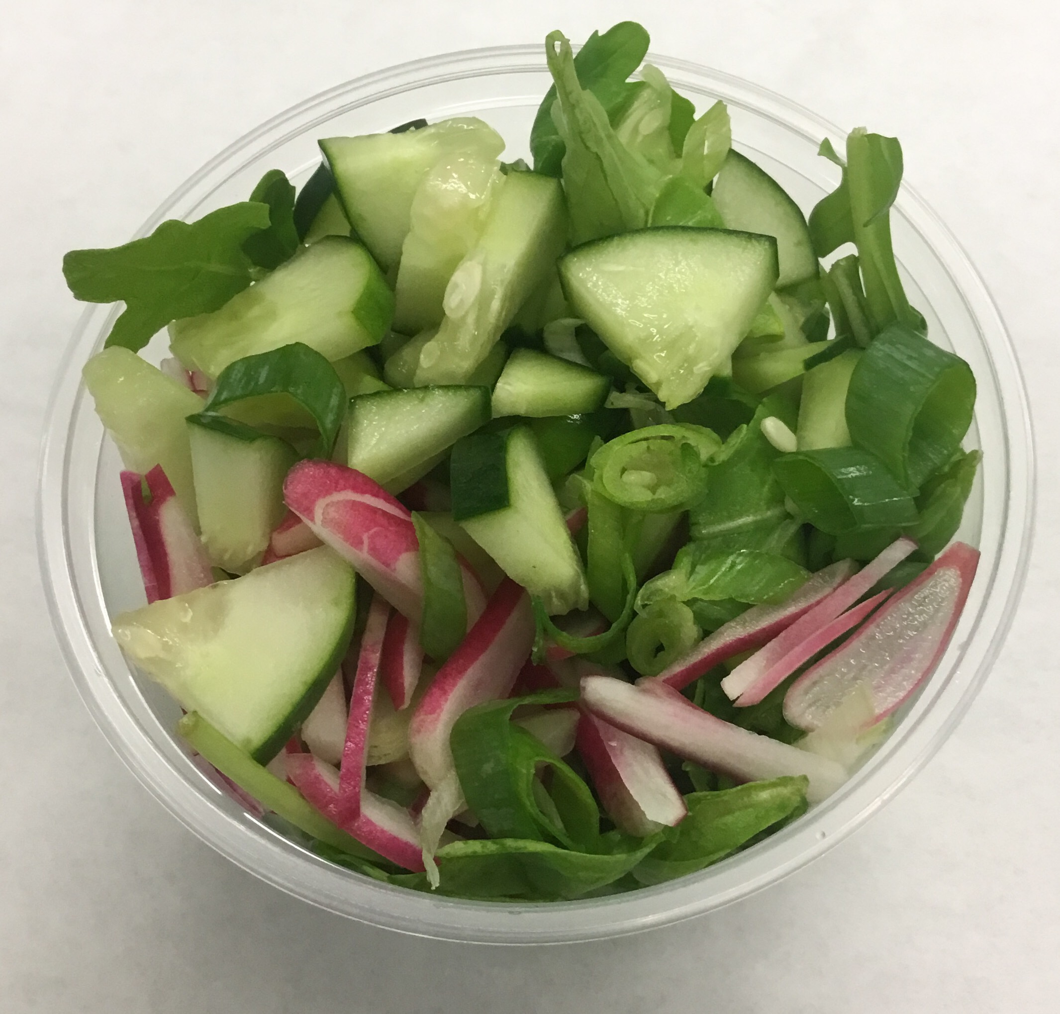 Arugula with cucumber, French breakfast red radish and scallions.