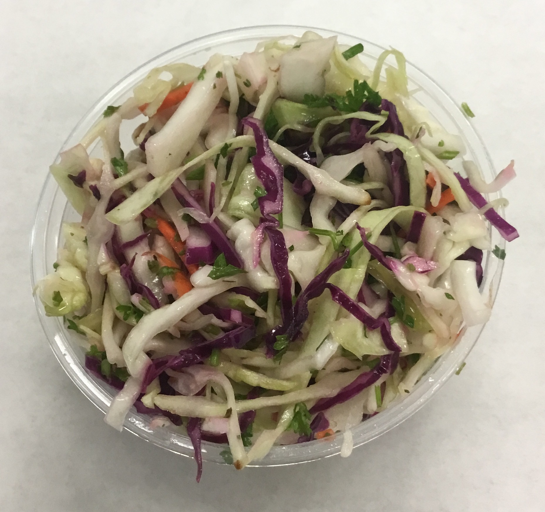Red and green cabbage coleslaw with Turkish apricots, parsley, lemon apple cider vinegar and olive oil.