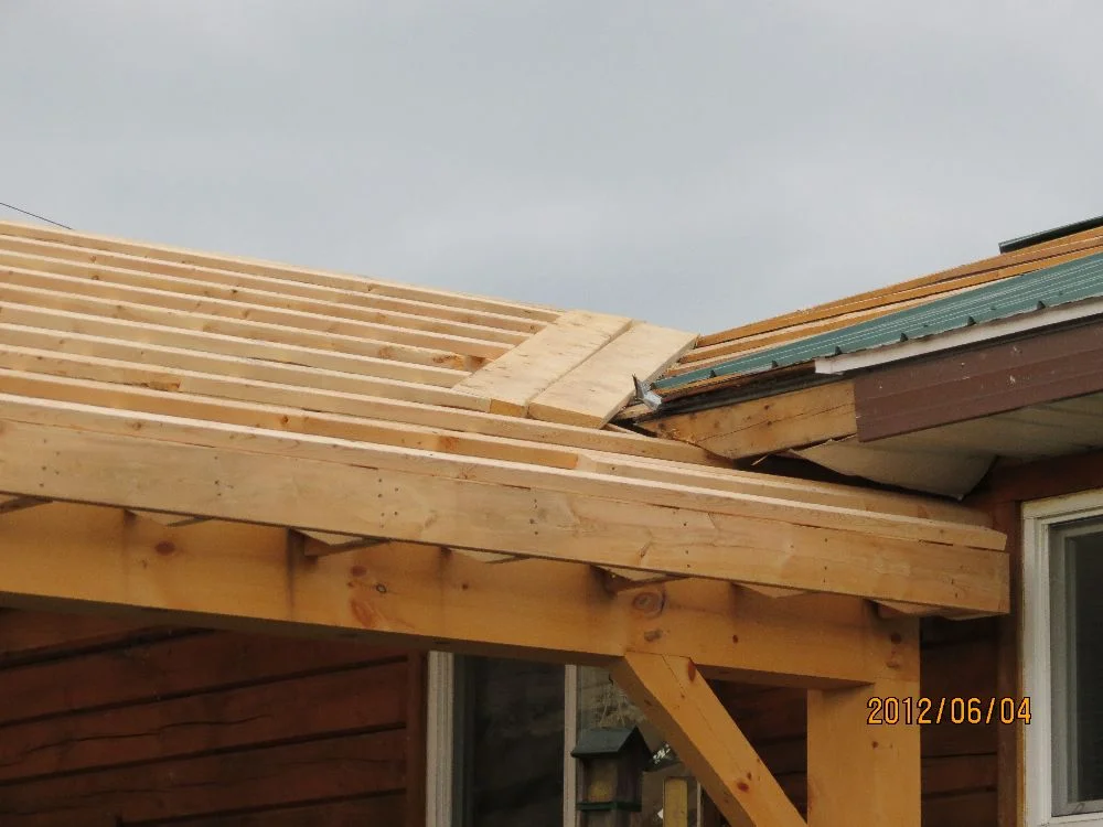 120604 carport strapping & cricket into the existing house roof