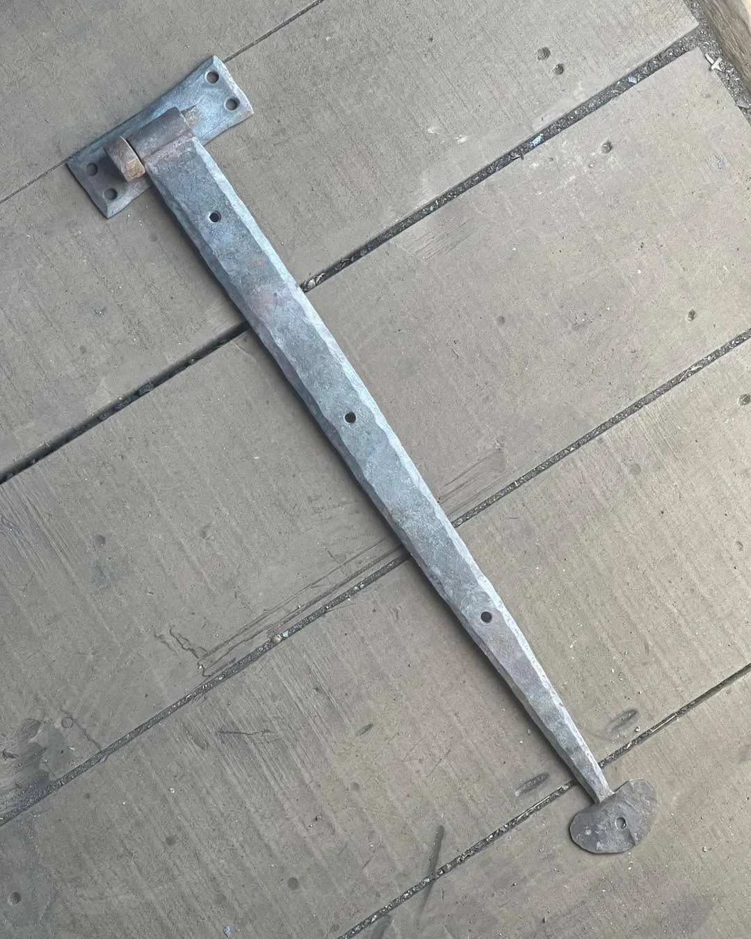 A look at one of the batch of two dozen  hinges we&rsquo;re working on for bureauinteriordesign. 20&rdquo; straps, forge-welded eyes and pintle hooks, the latter then tenoned into a surface backplate. Got a few more straps to make, and we have to ben
