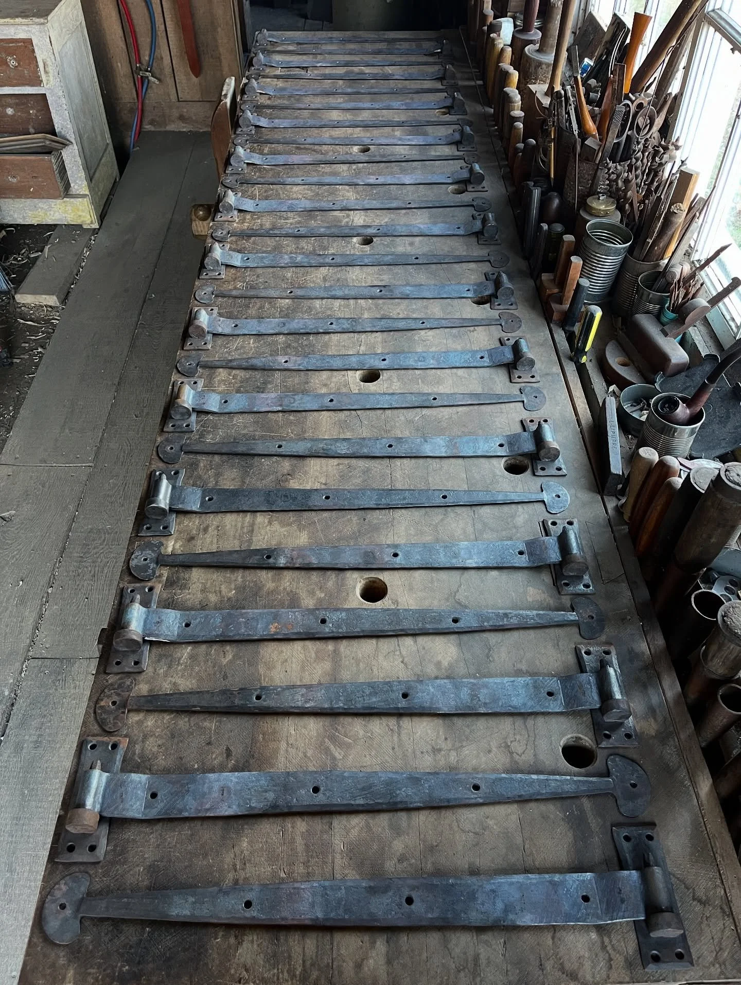 Nearing completion of one of the largest packages of hardware (in numbers of pieces) we&rsquo;ve done so far, headed to @bureauinteriordesign for one of their awesome projects. One part of the package is these two dozen strap hinges with forge-welded