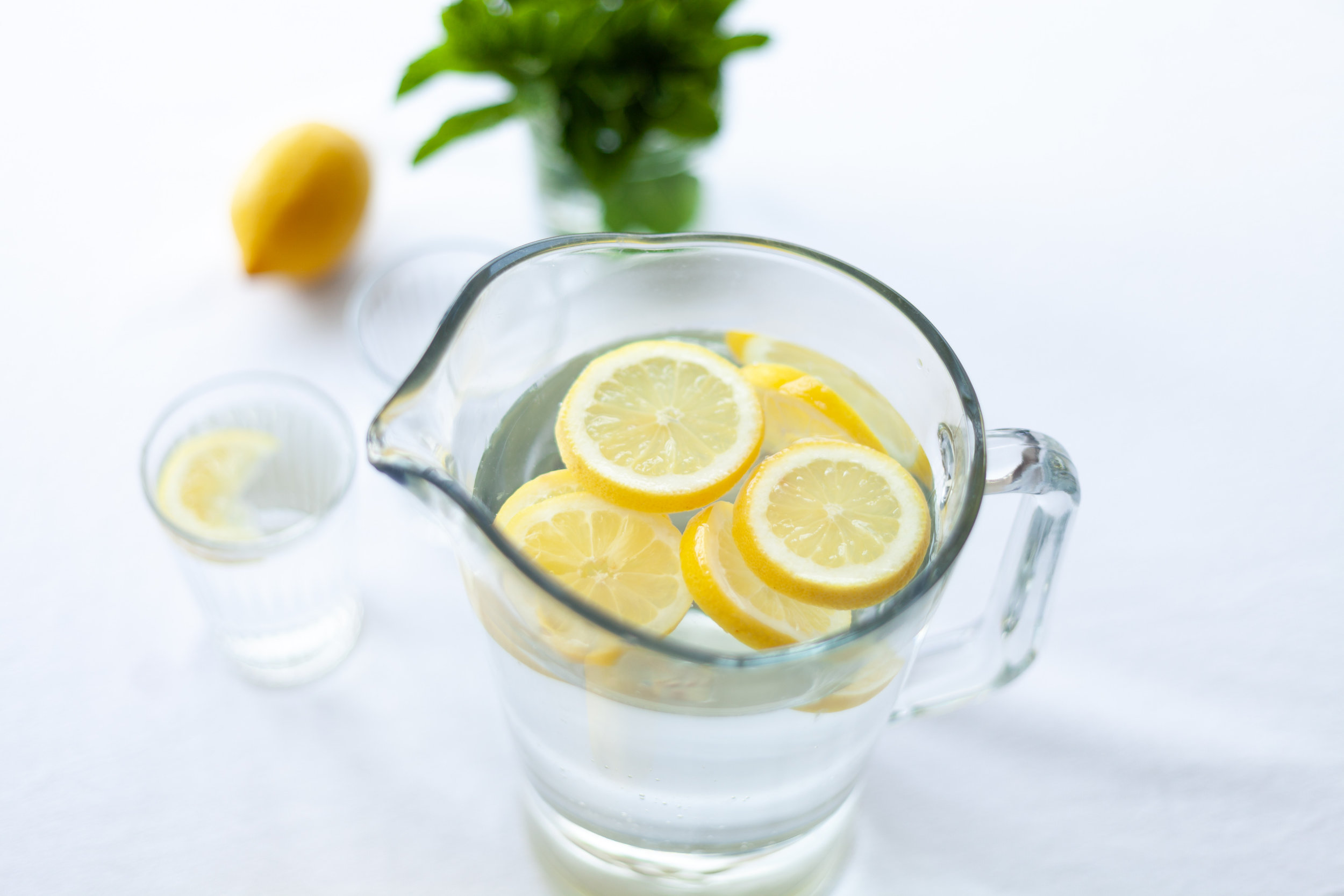 Canva - Sliced Lemon Fruit in Glass Picher.jpg