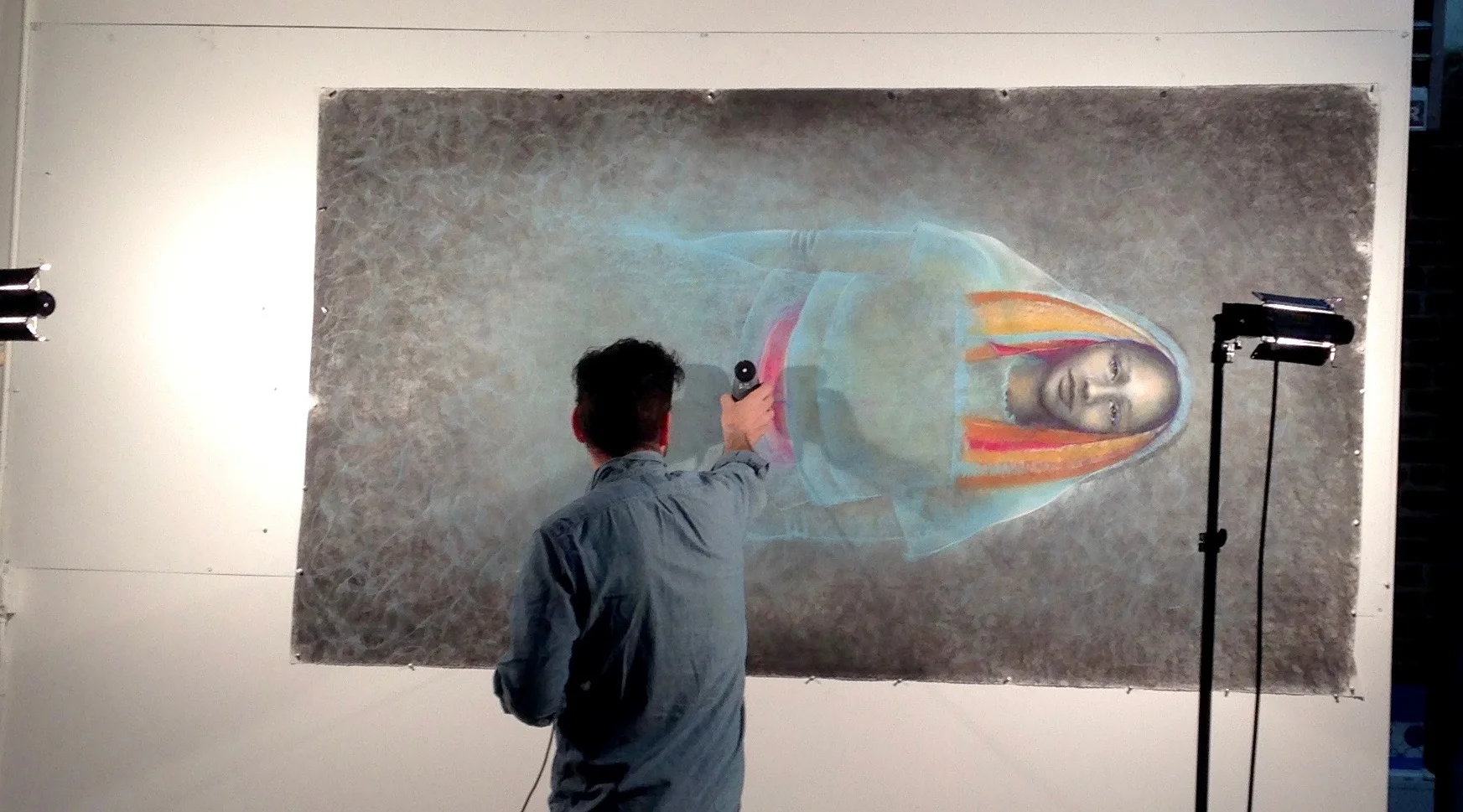 Candela owner, Brad Boca, checking light settings in preparation for the process of the digital image capture of original drawing, "Lamar."