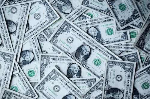 A jumbled pile of dollar bills.