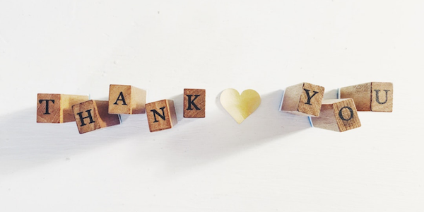 Wooden blocks spelling out the words, “Thank you.”