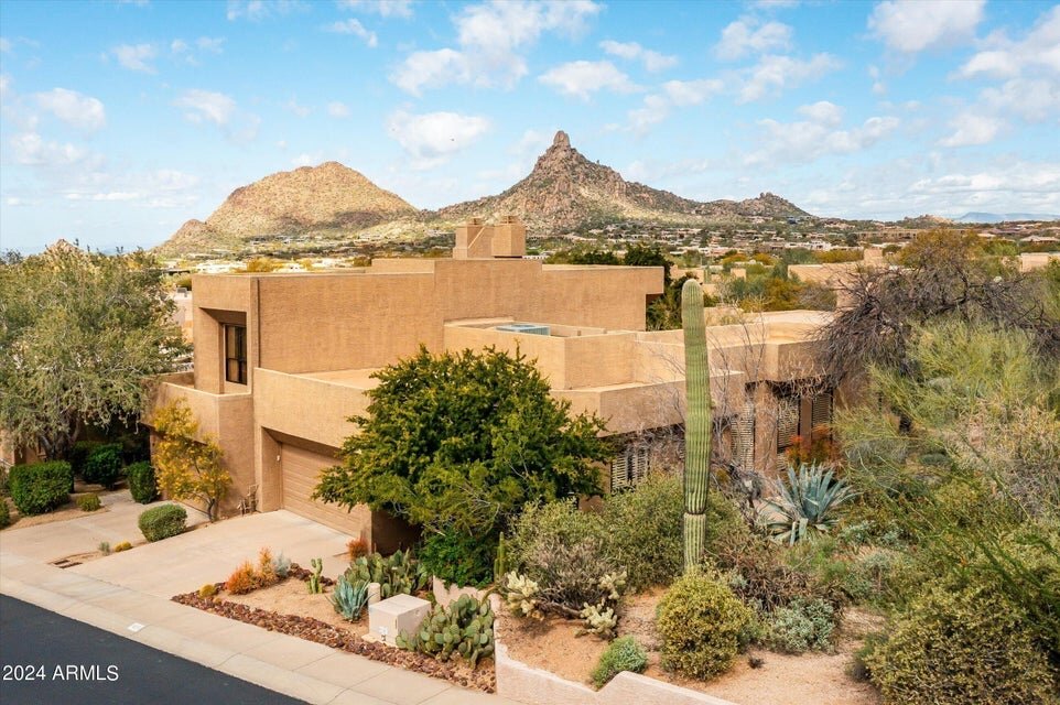 #NewListing #OpenHouse Discover luxurious desert living in this light and bright two-bedroom, two-bathroom corner unit townhome nestled within the prestigious Guard Gated community of Windy Walk at Troon Village. Split floor plan features include a l