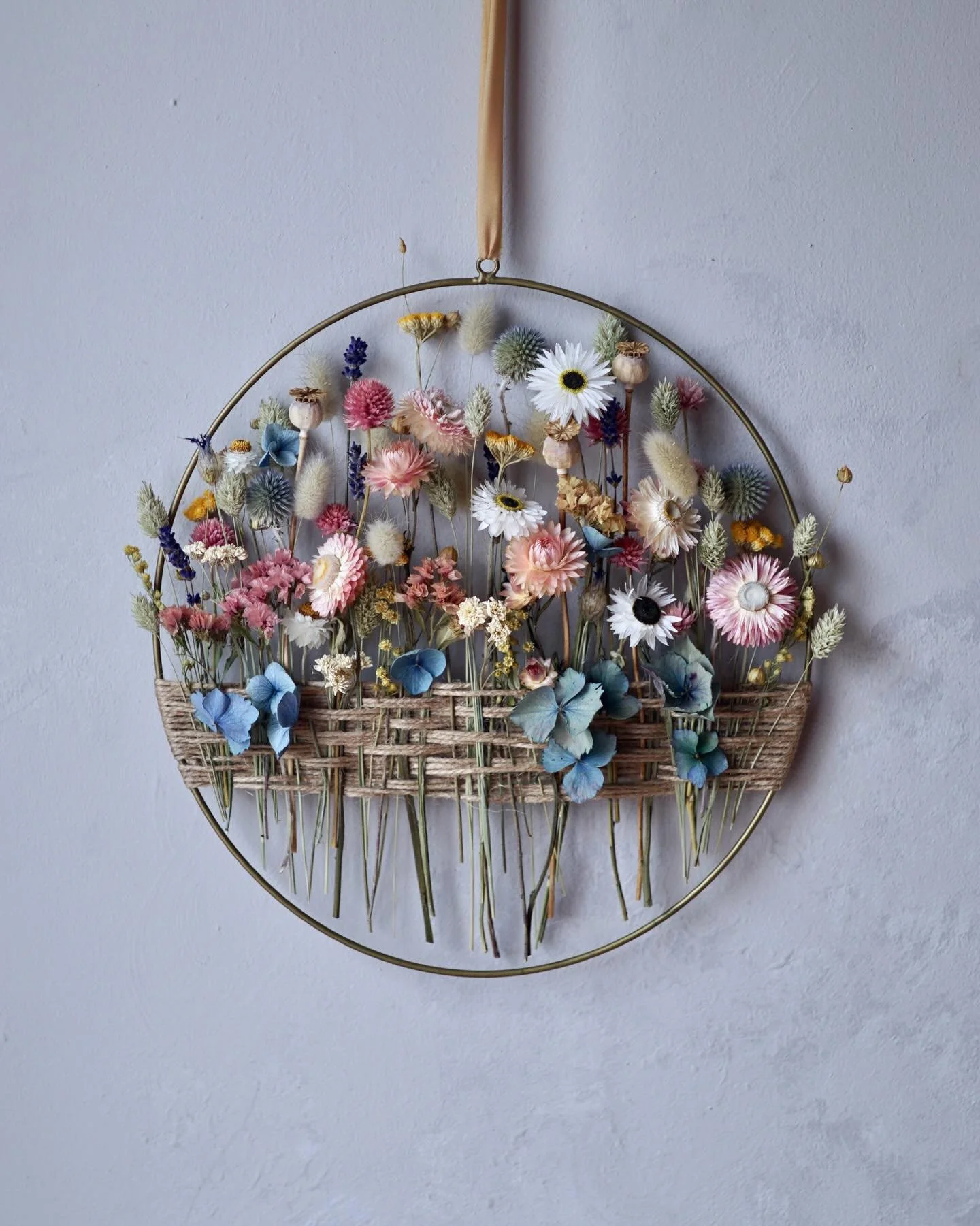 Have you made one of these flower hoops? I have questions!

This was a commission I made recently and obviously I went with a metal hoop. I experimented with using a wooden hoop (12&rdquo; across and about 1/2&rdquo; deep) but I struggled to keep the