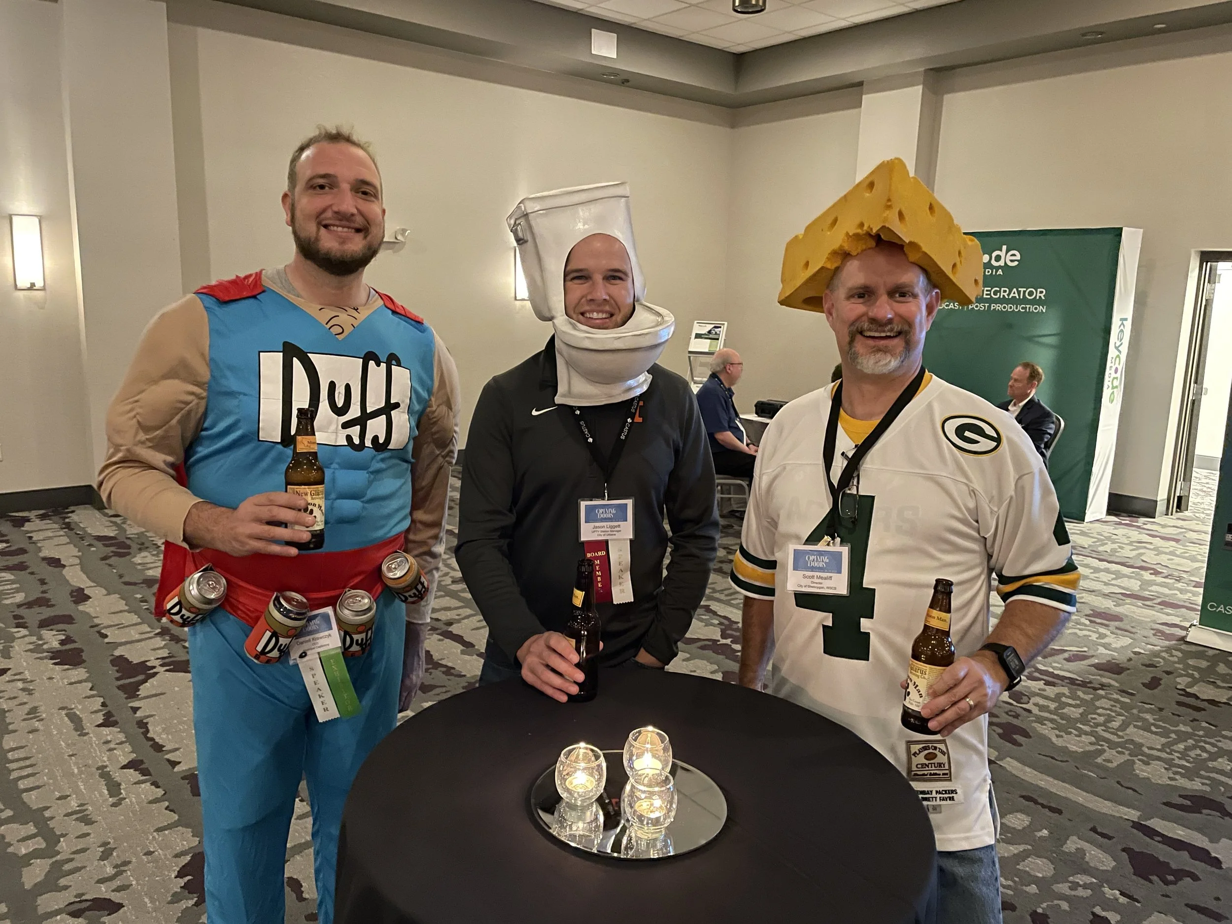 Municipal Captioning Founder Daniell Kraczyk, Jason Liggett from Urbana Public Television and Scott Mealiff from WSCS Sheboygan ham it up at the costume party.