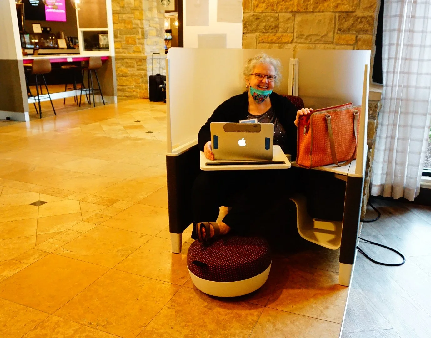 Mary Rhodes, an independent producer from Kenosha, test drives a work pod at the hotel.