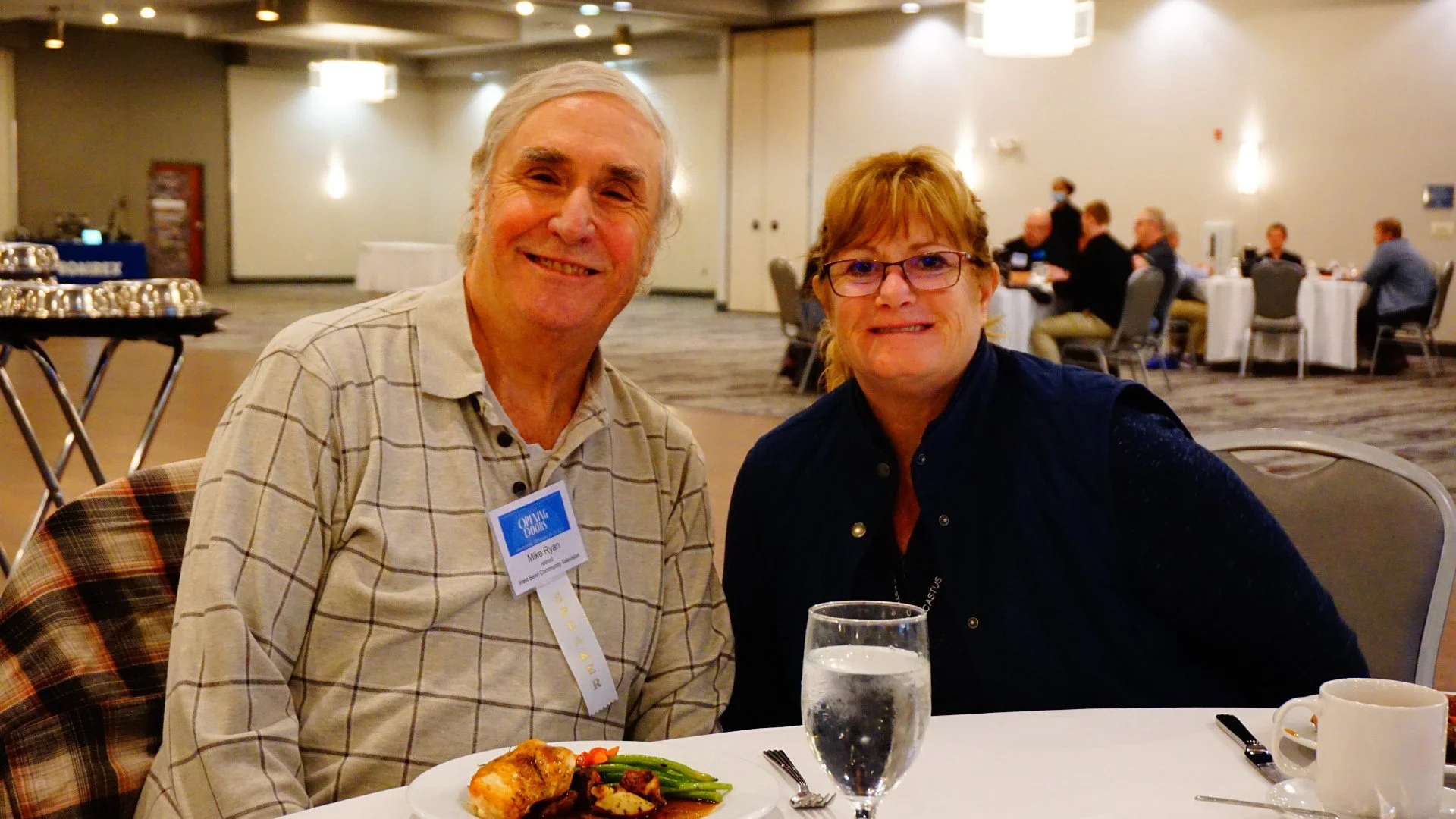 2021 WCM Hall of Fame Inductee Mike Ryan poses with WCM Treasurer Deb Brunett at the Opening Luncheon.  