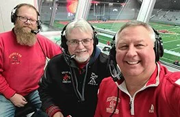 The football broadcast team: Jamison Rabbitt, Mike Powers and Bill Baker