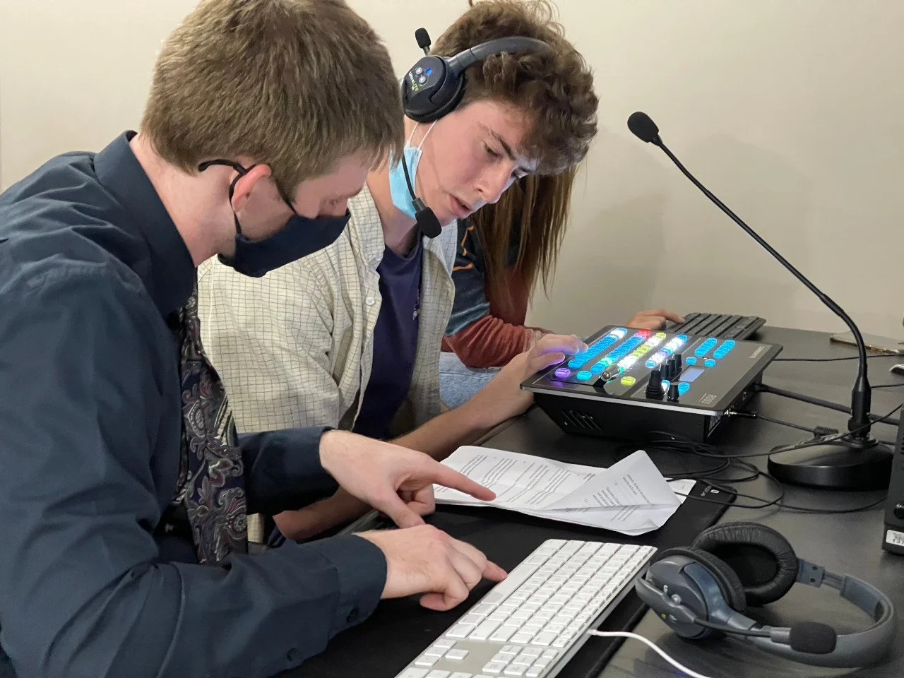  Students Logan Eischeid and Tommy Silk prep for broadcast 