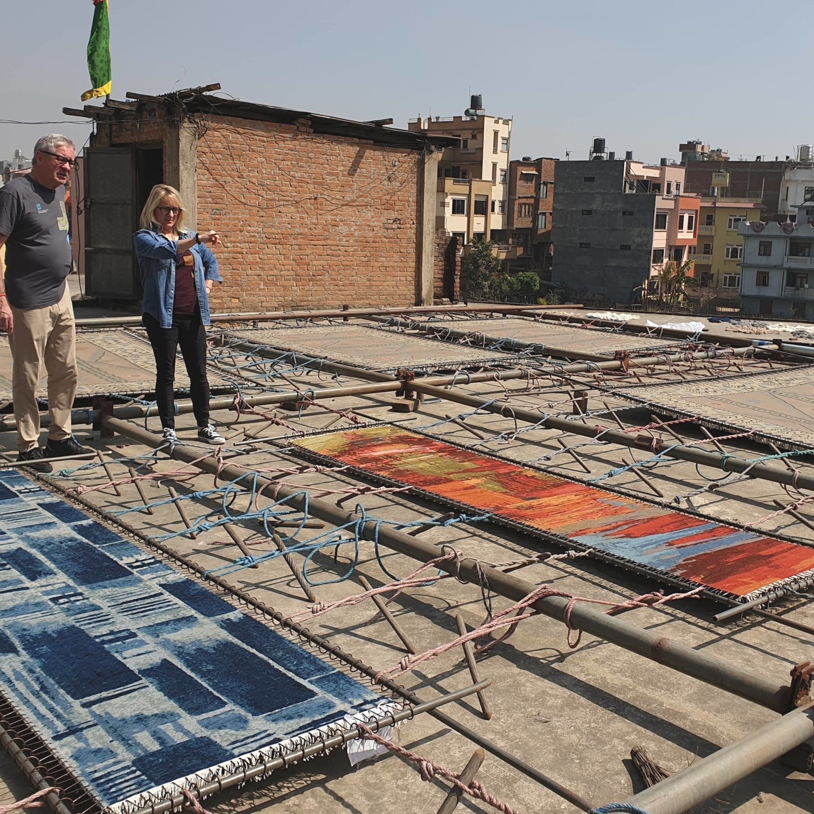   Heather and Jim inspecting carpets in Kathmandu  