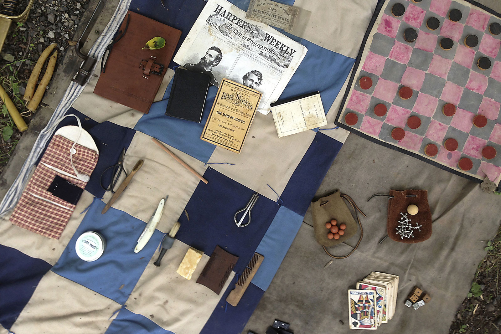 Small articles of humanity such as a pack of playing cards, a journal or photos from home would have been the few personal items a Civil War era soldier would have carried throughout the war.