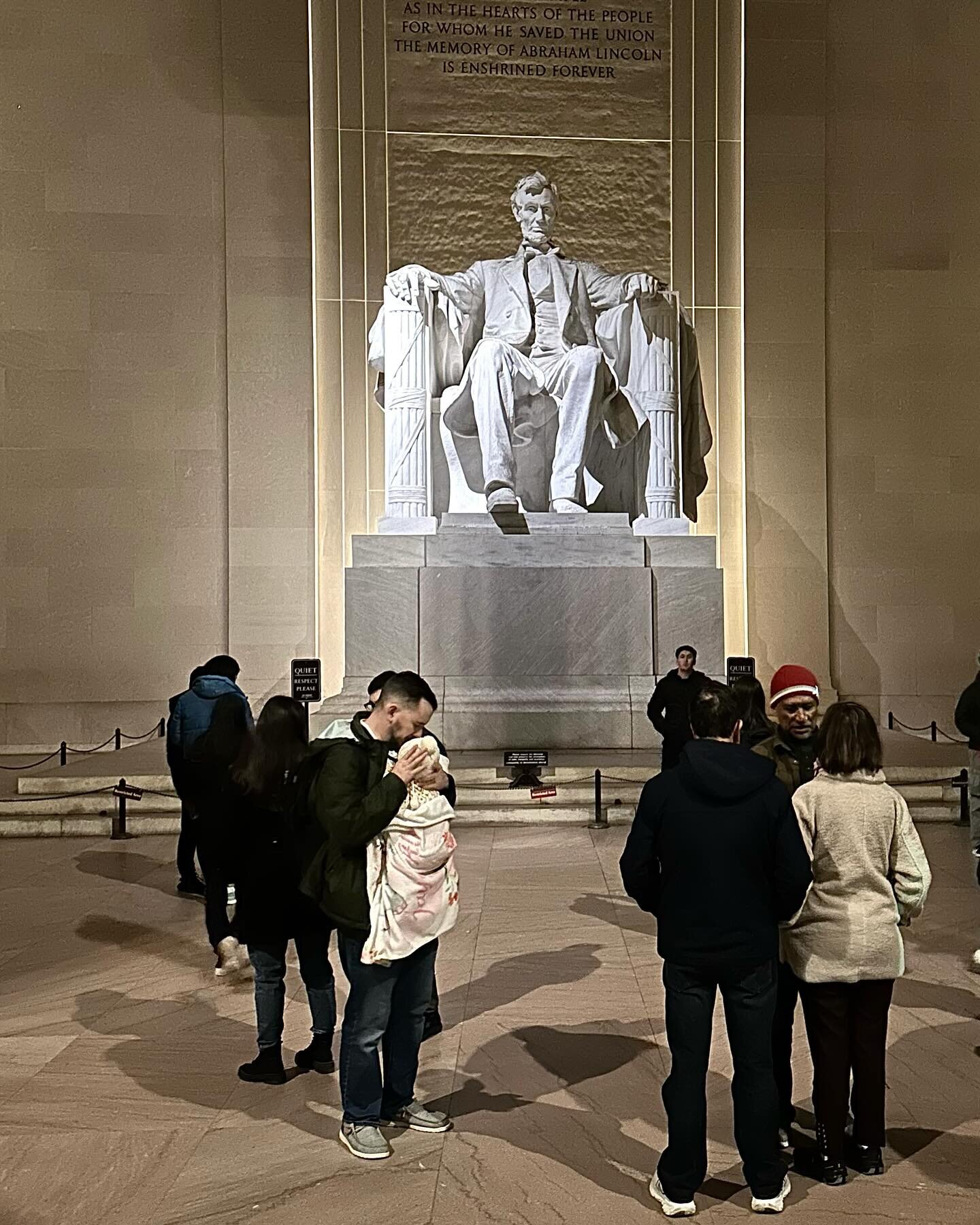 Washington, DC highlights.

Photo One:
A man holds an infant in the central chamber of the Lincoln Memorial.
1919, 020124

Photo Two:
Ben&rsquo;s Chili Bowl chili half-smoke with fries, Diet Coke and strawberry milkshake with whipped cream with a che