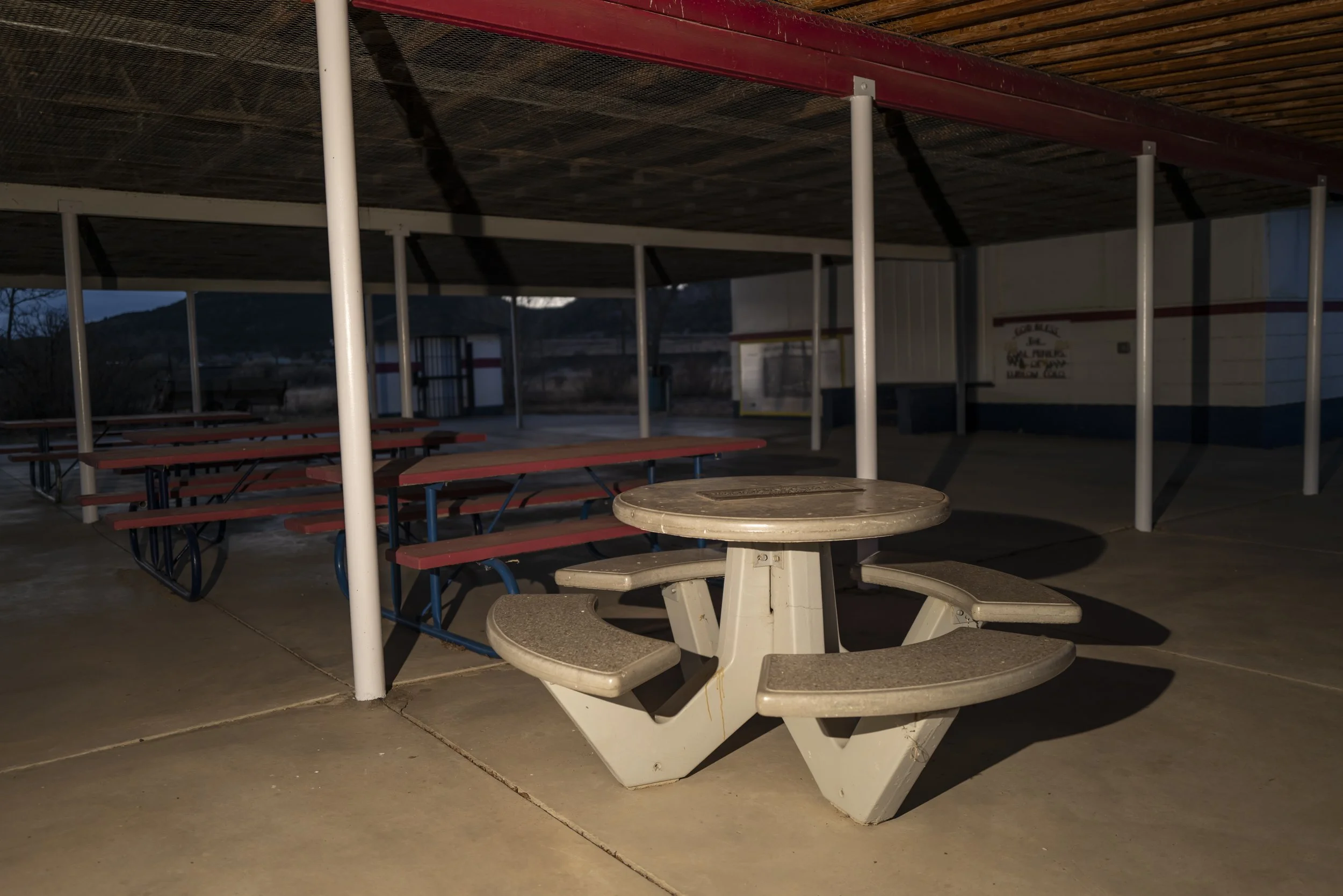 Night photograph of the Ludlow Massacre site showing an empty shelter and picnic area in southern Colorado.