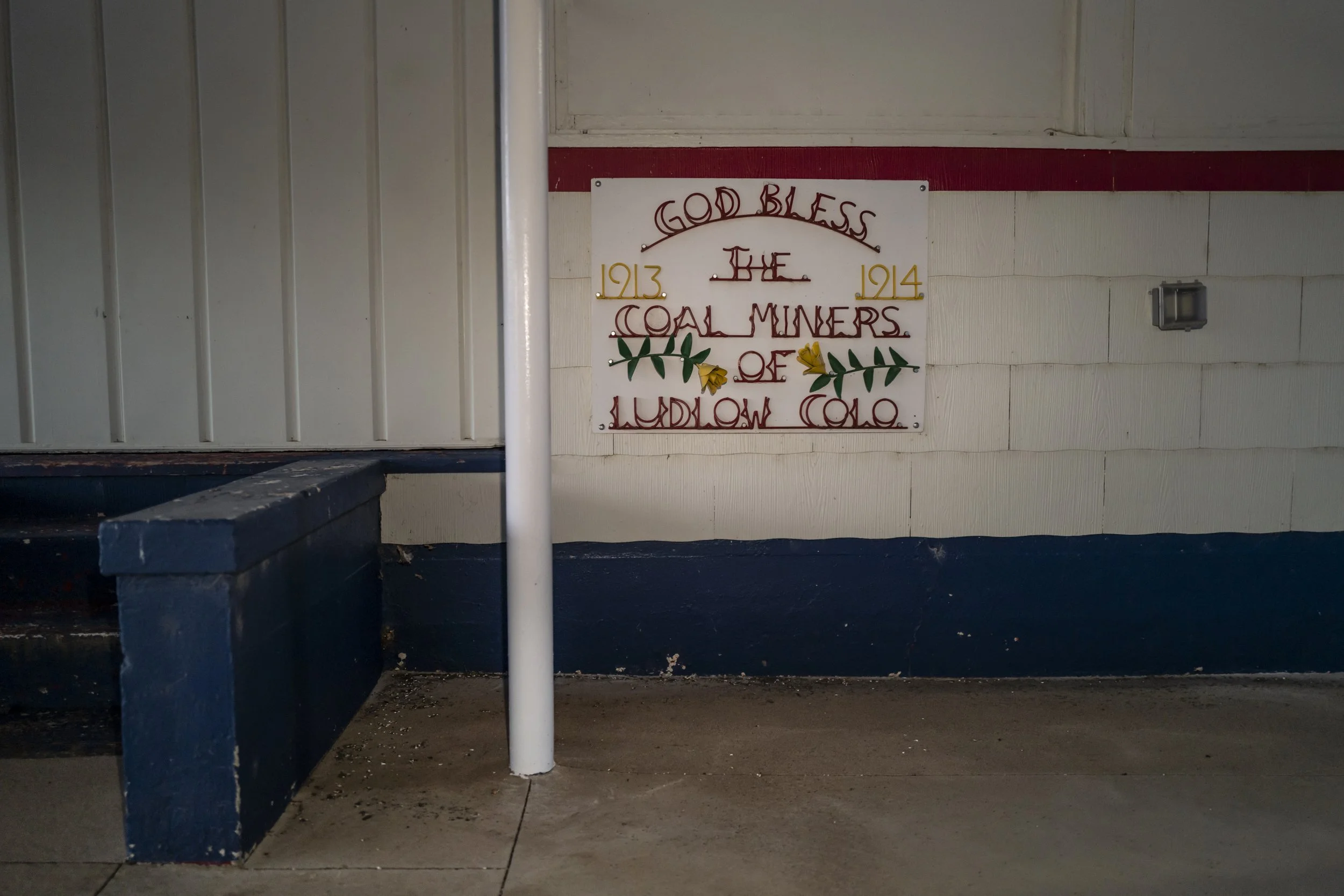 Interior wall message honoring coal miners at the Ludlow Massacre site in Colorado, reflecting the lasting impact of the 1914 tragedy.