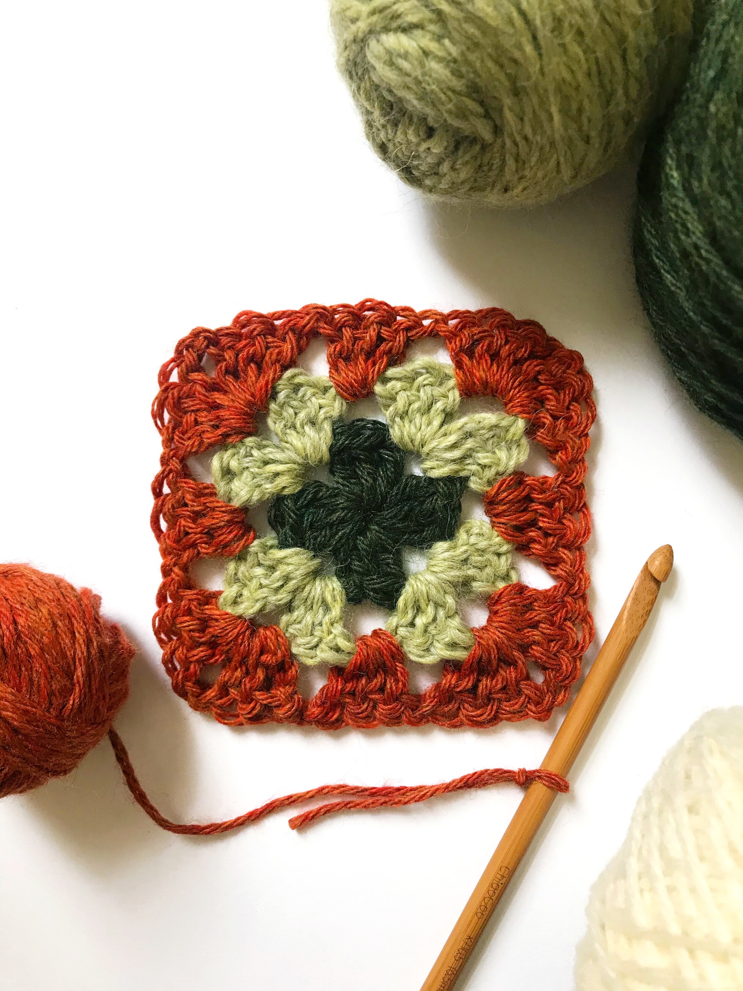 One scrap granny square done, one to go - Crochetbug