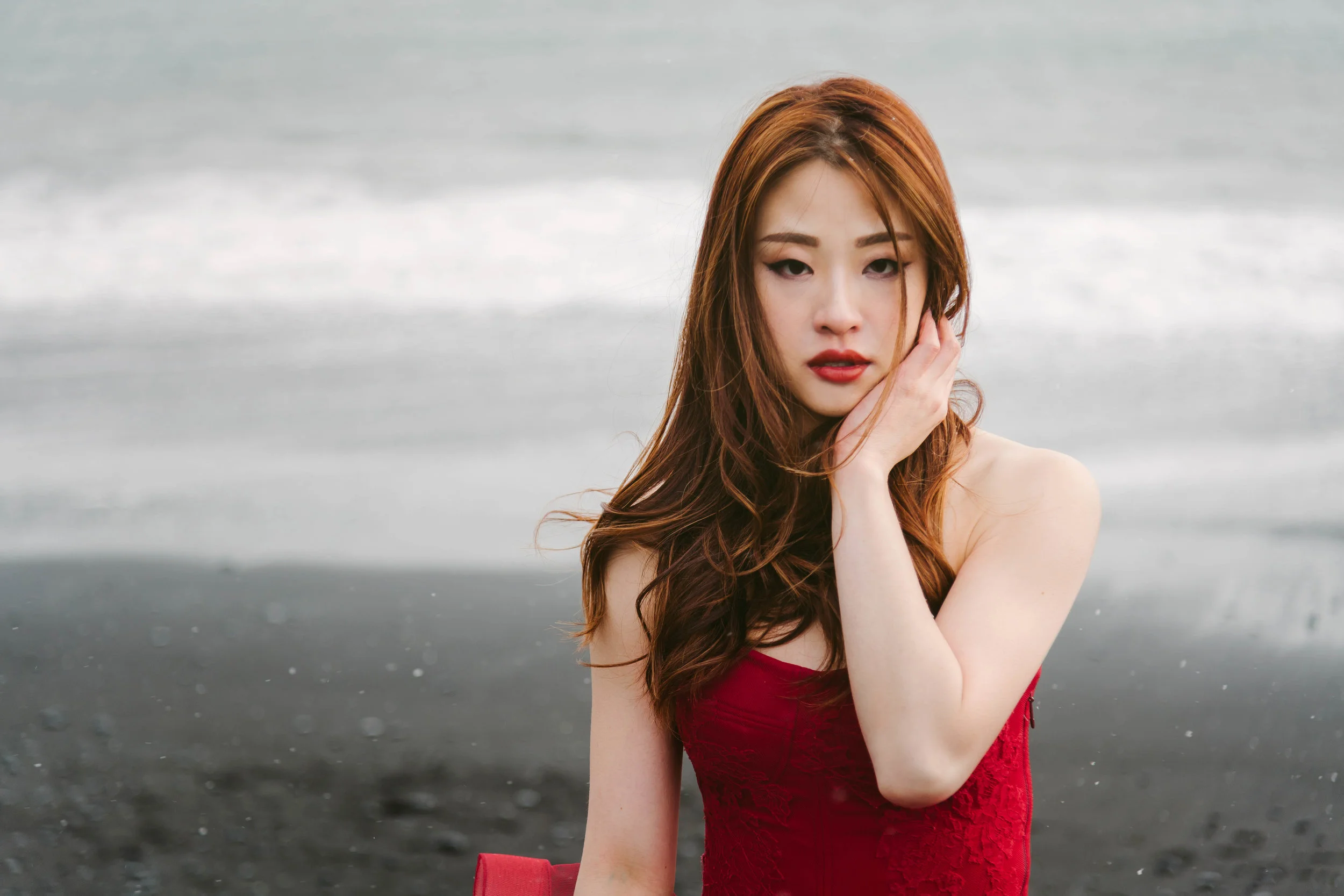 Makeup by Autelier Artist Cherry Au: warm brown eyeshadow with defined eyeliner and red lips on alluring Sophia