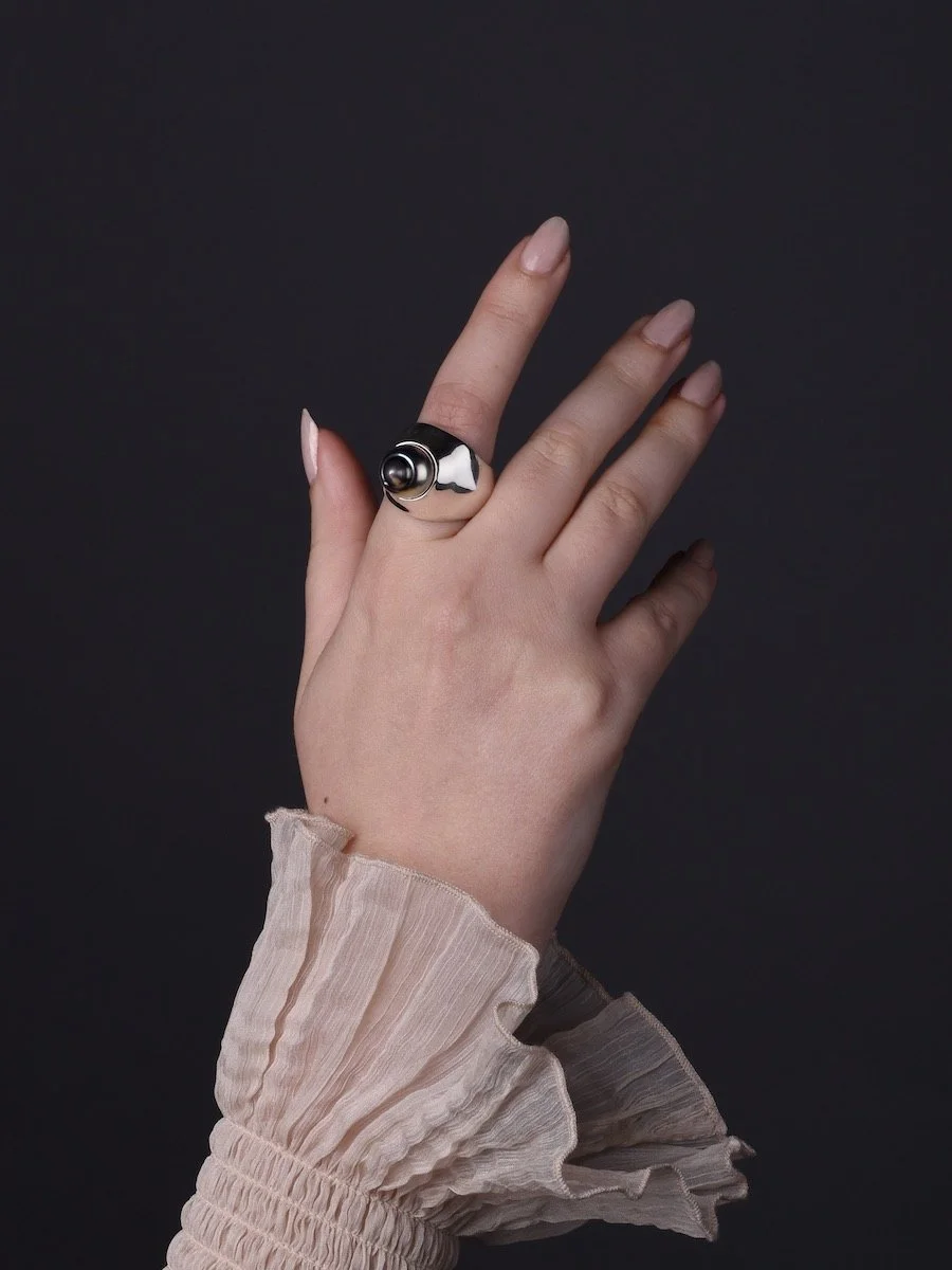 model wearing statement Tahitian pearl and silver Shore spinning ring by Charlotte Garnett