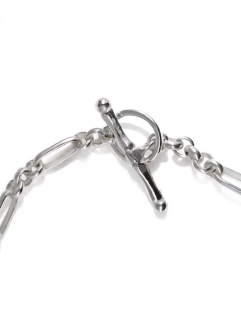 close up of t-bar toggle clasp on figaro sterling silver chain bracelet by Charlotte Garnett