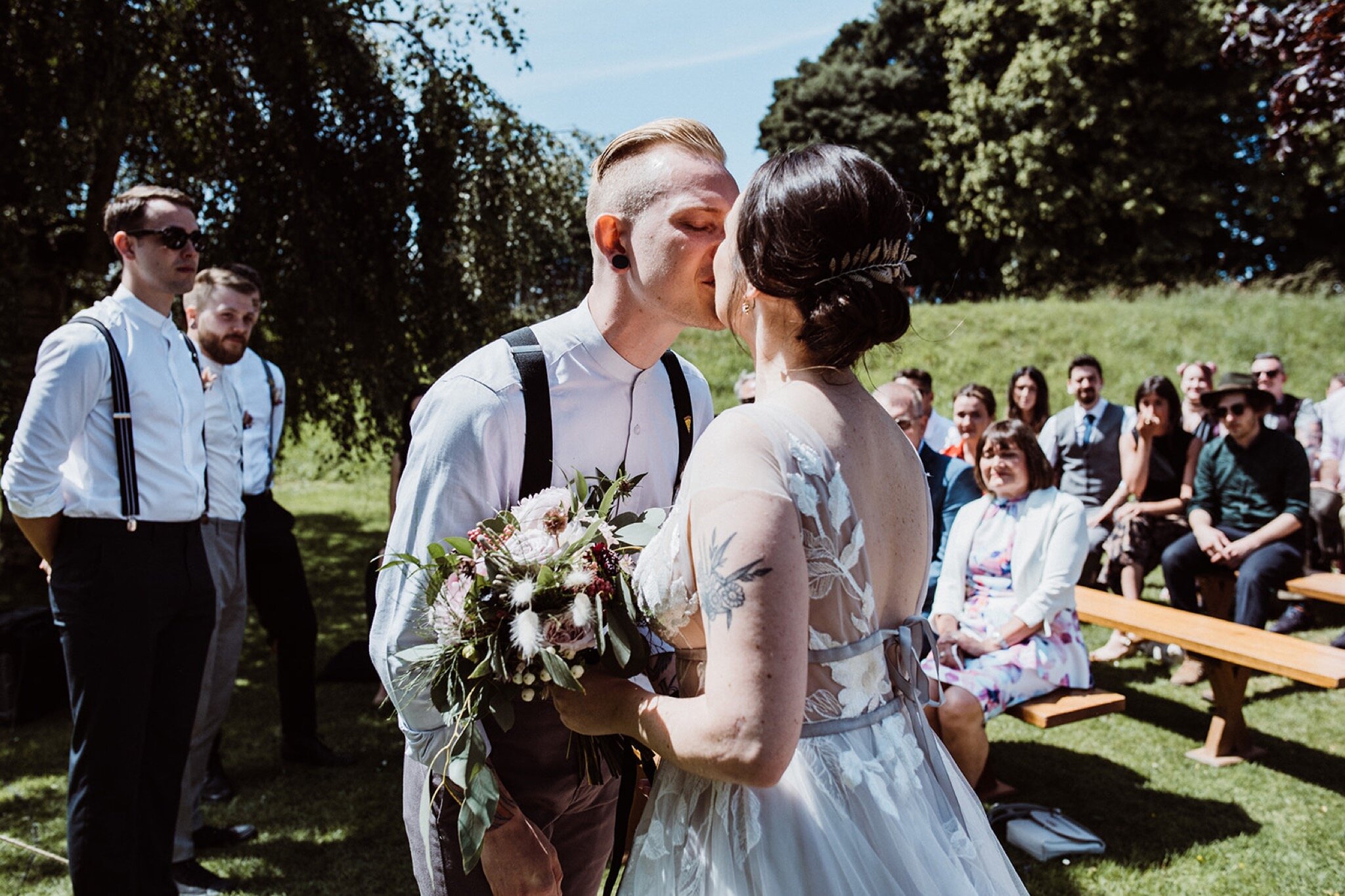 15_V+D Wedding-156_Groom and bride kissing. Summer outdoor humanist wedding ceremony..jpg