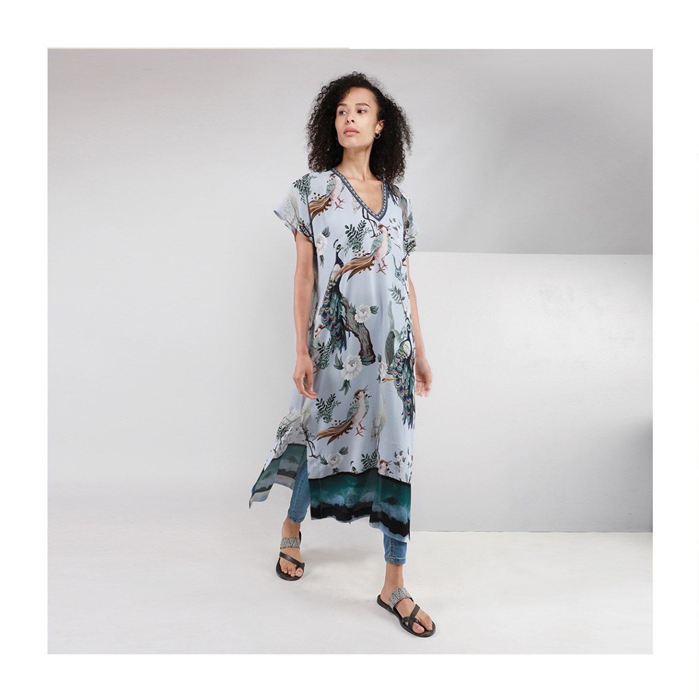 A transitional colour palette, a subtle hand detailed interlacement neckline and a dramatic tie dye inspo border make this piece a perfect multi-use wardrobe addition. Layer over skinny jeans with a pair of trainers, a bikini and sandals , or with he