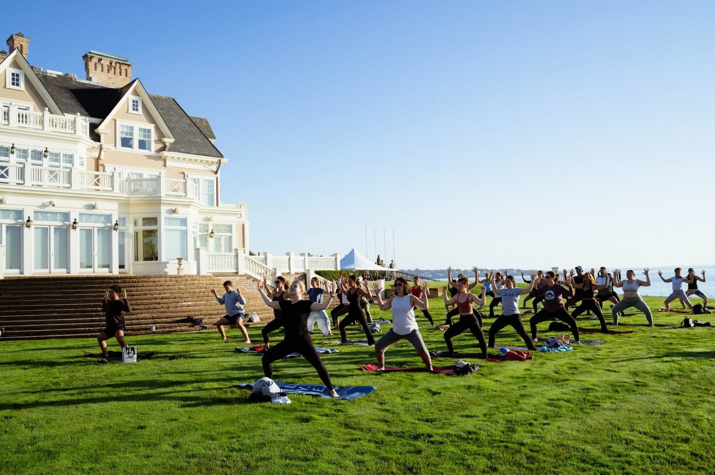 More than just cars 🧘 Enjoy lifestyle events like Yoga at the Concours during Audrain Newport Concours &amp; Motor Week

📸 @francescadolnier
-
-
#yoga #concoursdelegance #newportri #audrainmotorweek #acmw