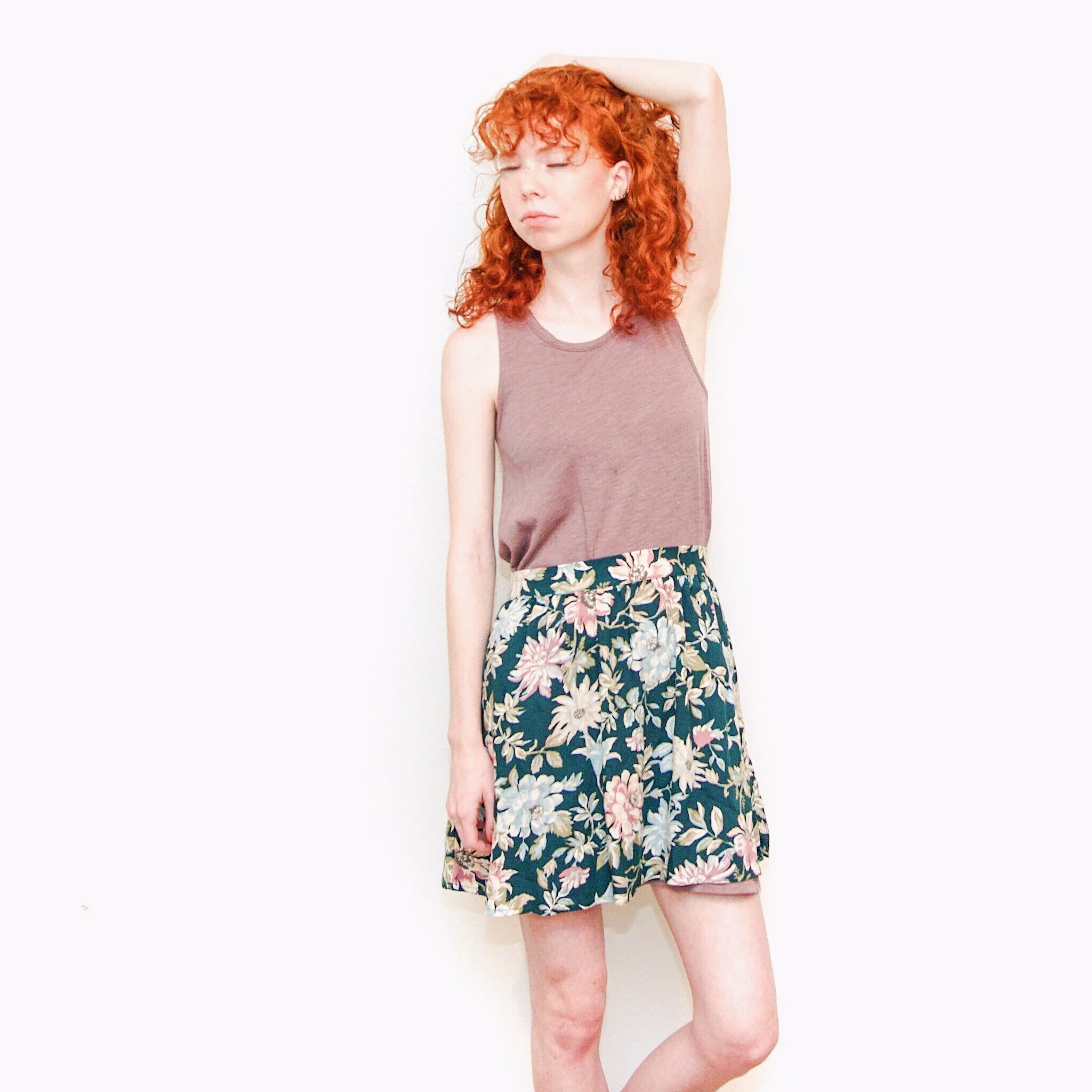 girl-in-purple-shirt-and-floral-skirt