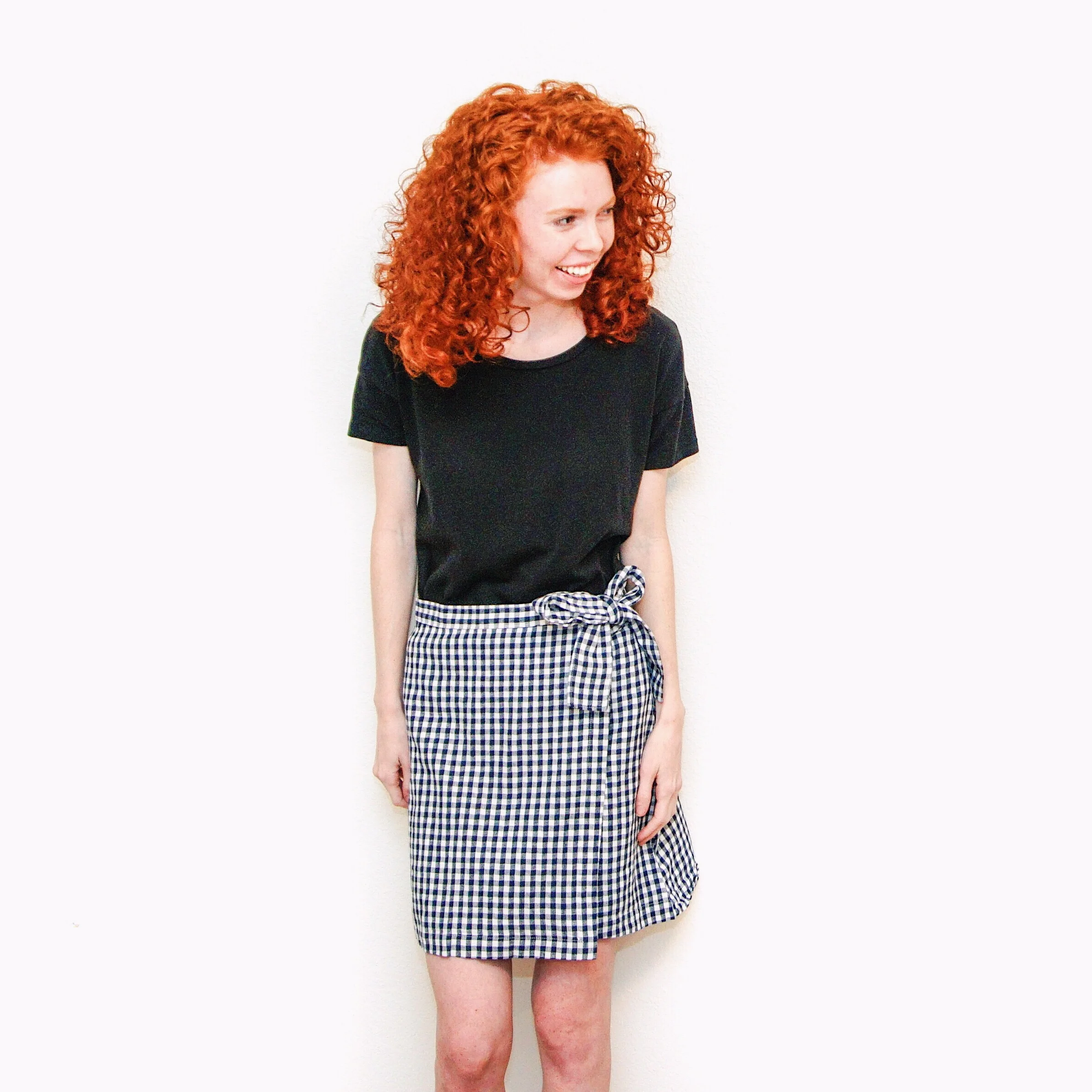 girl-in-black-shirt-and-gingham-skirt